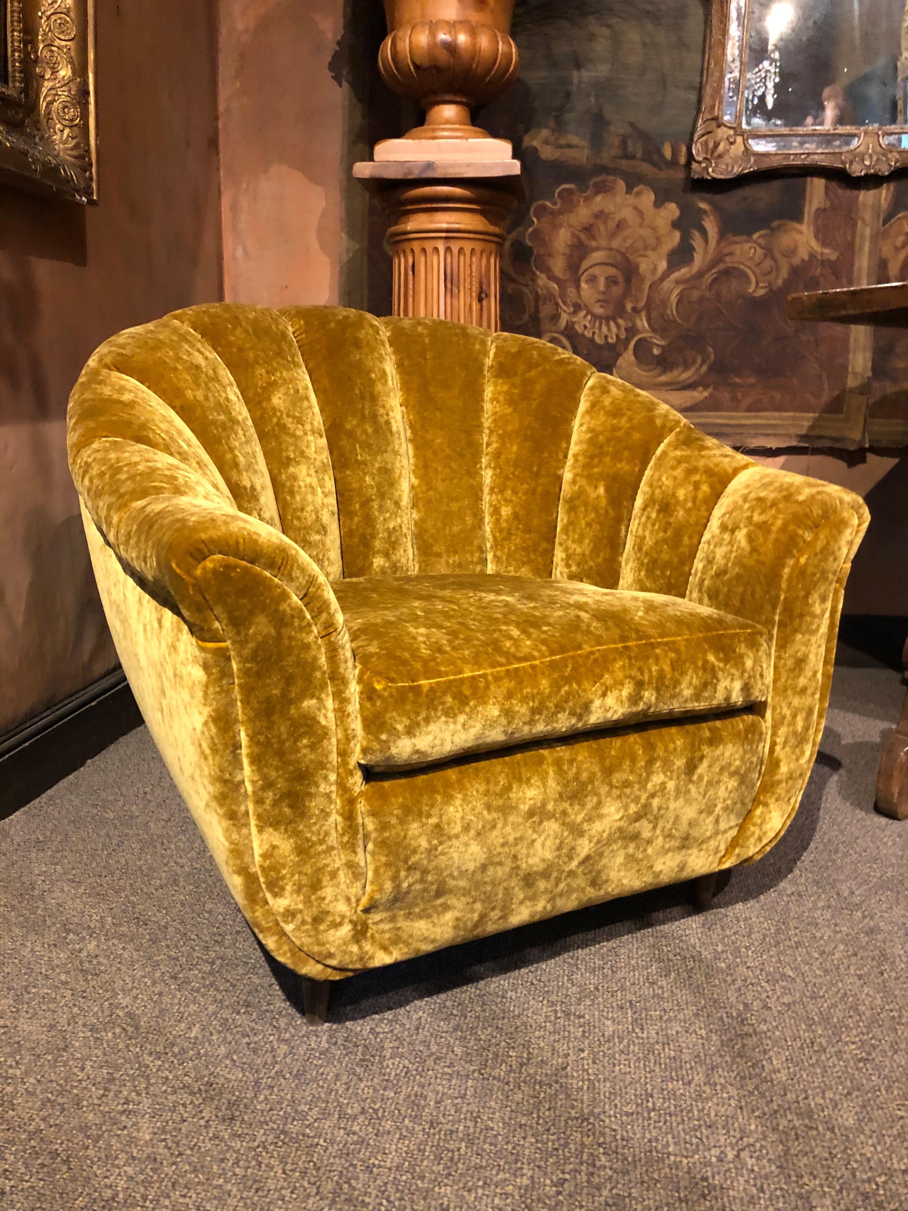 Re-upholstered with a golden mustard changing velvet fabric. Wooden leg. Seashell shape,
circa 1940
Italy

Sofa
Height : 31.4 in 
Seat height : 15.7 in
Length : 81.8 in
Depth : 25.5 in

Pair of armchairs, each 
Height : 32.2 in
Seat