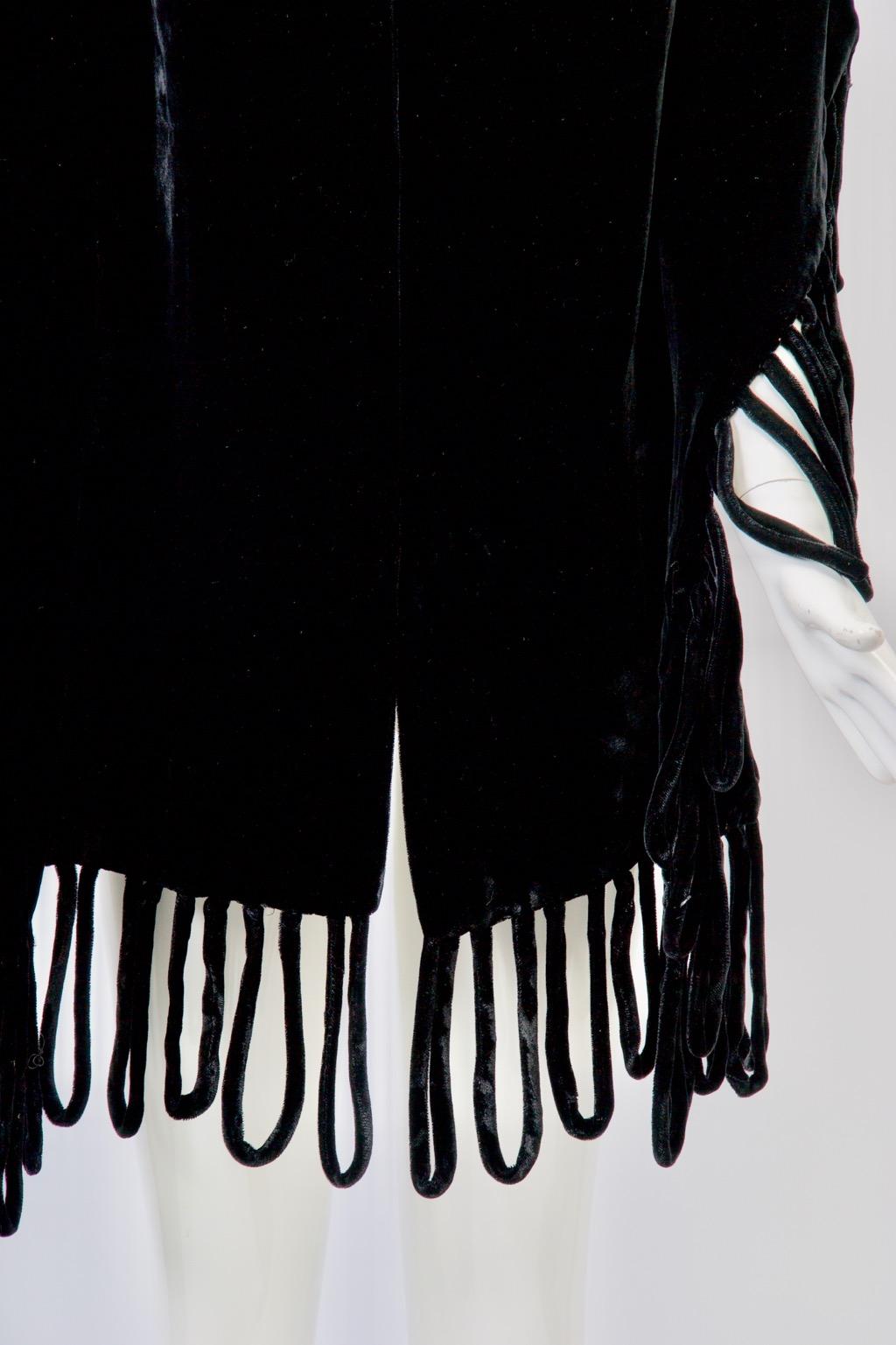 1950s black velvet shawl with self looped fringe along back and bottom edges. Double-faced velvet.