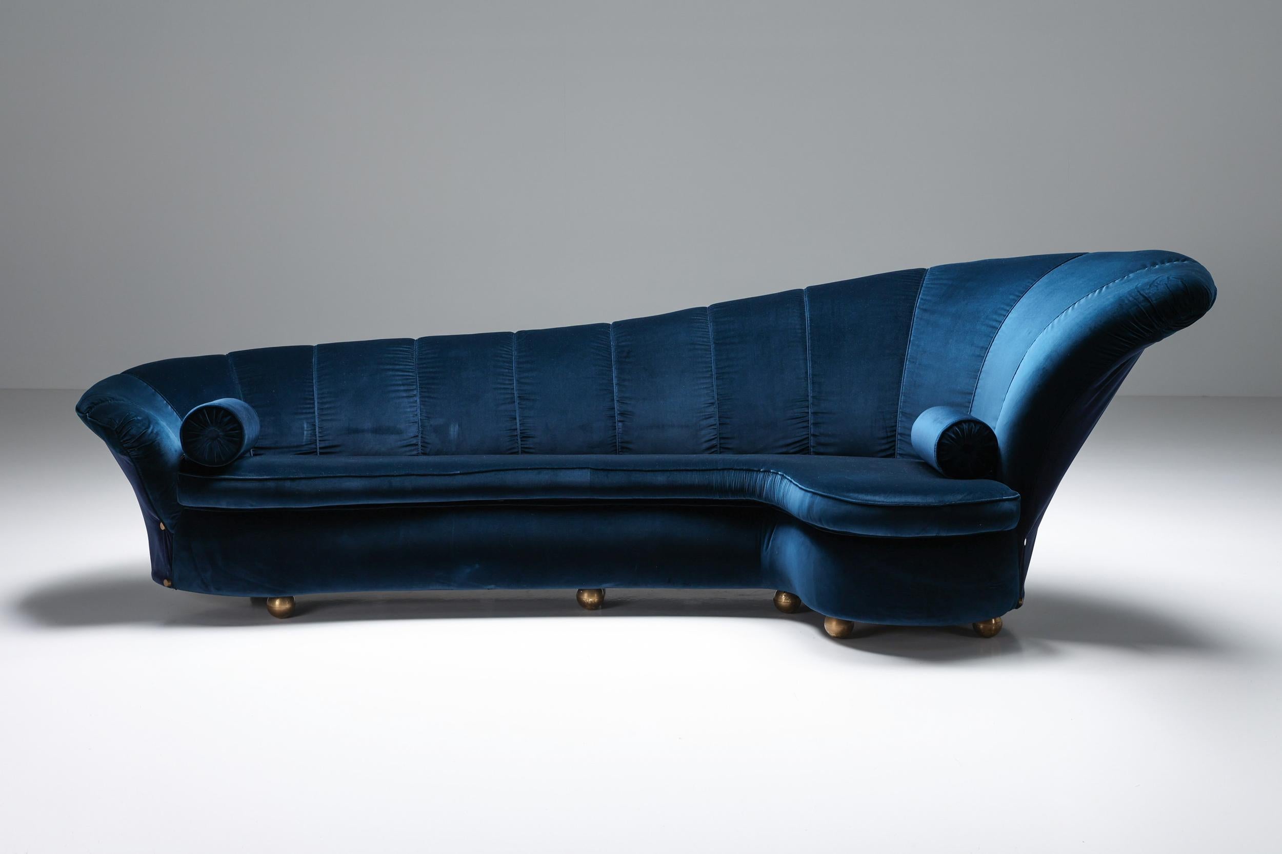 Marzio Cecchi; Italian design; Italy; Glam; Hollywood Regency; Blue velvet; Brass; Post-modern; Firenze; 

Italian glam couch newly reupholstered in blue velvet and attributed to Marzio Cecchi. A remarkable detail is the round brass feet. This piece