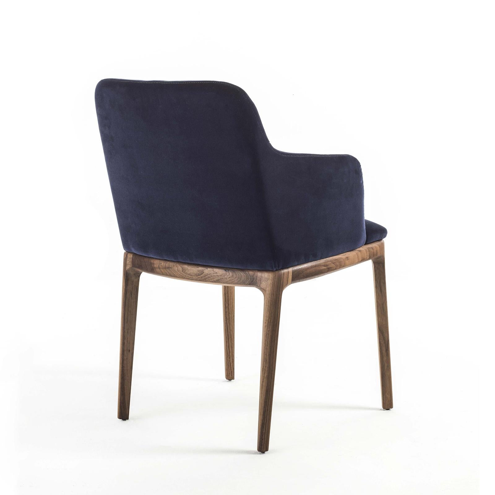 Armchair velvet walnut with structure in solid walnut wood,
plished and treated with natural pine extracts. Upholstered
and covered with high quality blue deep velvet fabric.
Also available in velvet walnut chair, without armrests.
Also available