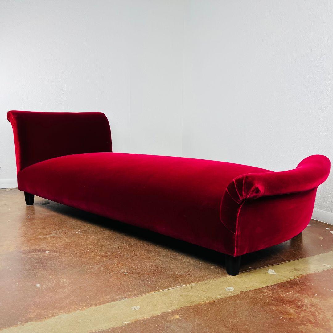 Swanky vintage low chaise lounge recently upholstered in wine colored velvet upholstery. Very good, lightly used condition with some minor wear consistent with age and use. Sturdy and stable. 