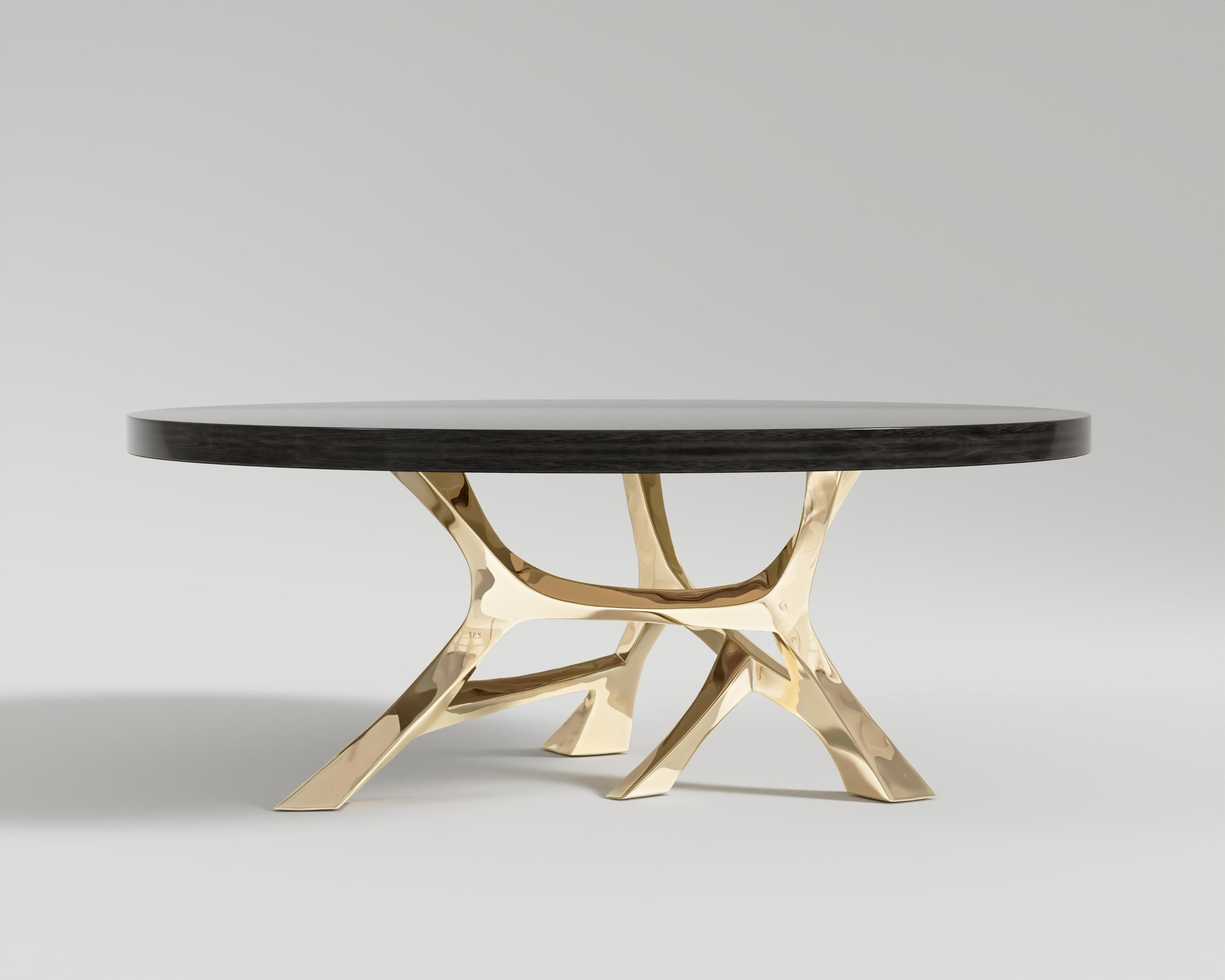 Vena Round Dining Table – Polished Bronze
Introducing the “Vena” – a transcendent masterpiece that embodies the pinnacle of luxury and craftsmanship in the world of bespoke furniture. This exquisite dining table is not just an ensemble; it’s an