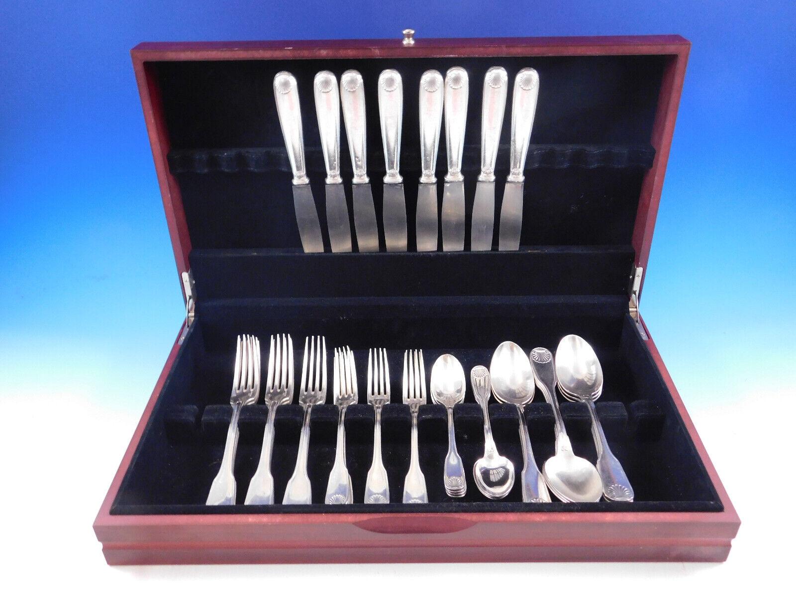 Vendome Arcantia by Christofle France Silverplated flatware set, 40 pieces. This pattern features the same shell motif that adorned the ceremonial silverware used during the reign of King Louis XIV. This set includes:

8 dinner knives, 9 3/4