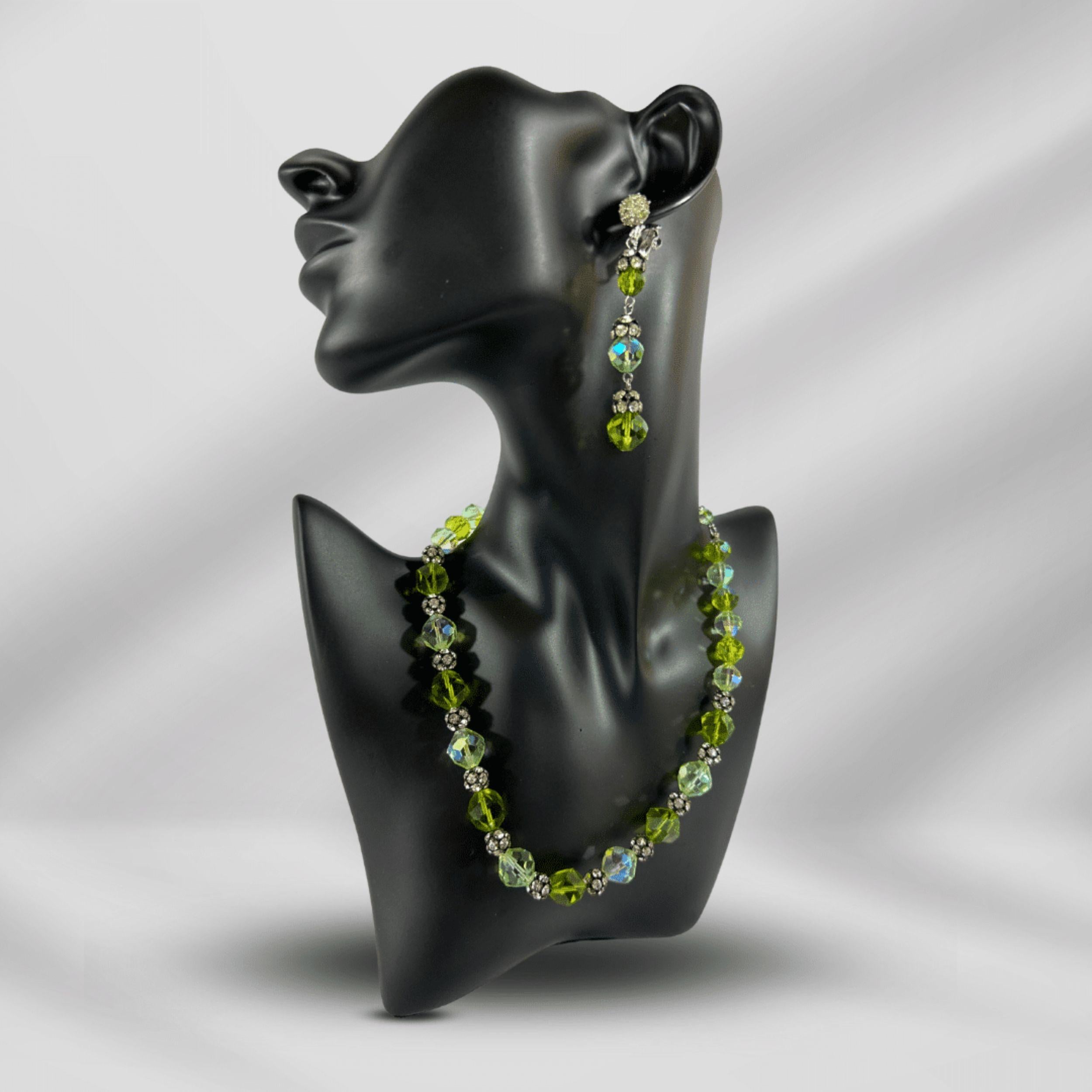 An Exquisite Example of Mid-Century Costume Jewelry

Description:

This captivating necklace and earrings set by Vendome, the high-end label of Coro Jewelry (1944–1979), exemplifies the brand's commitment to luxury and innovative design. The
