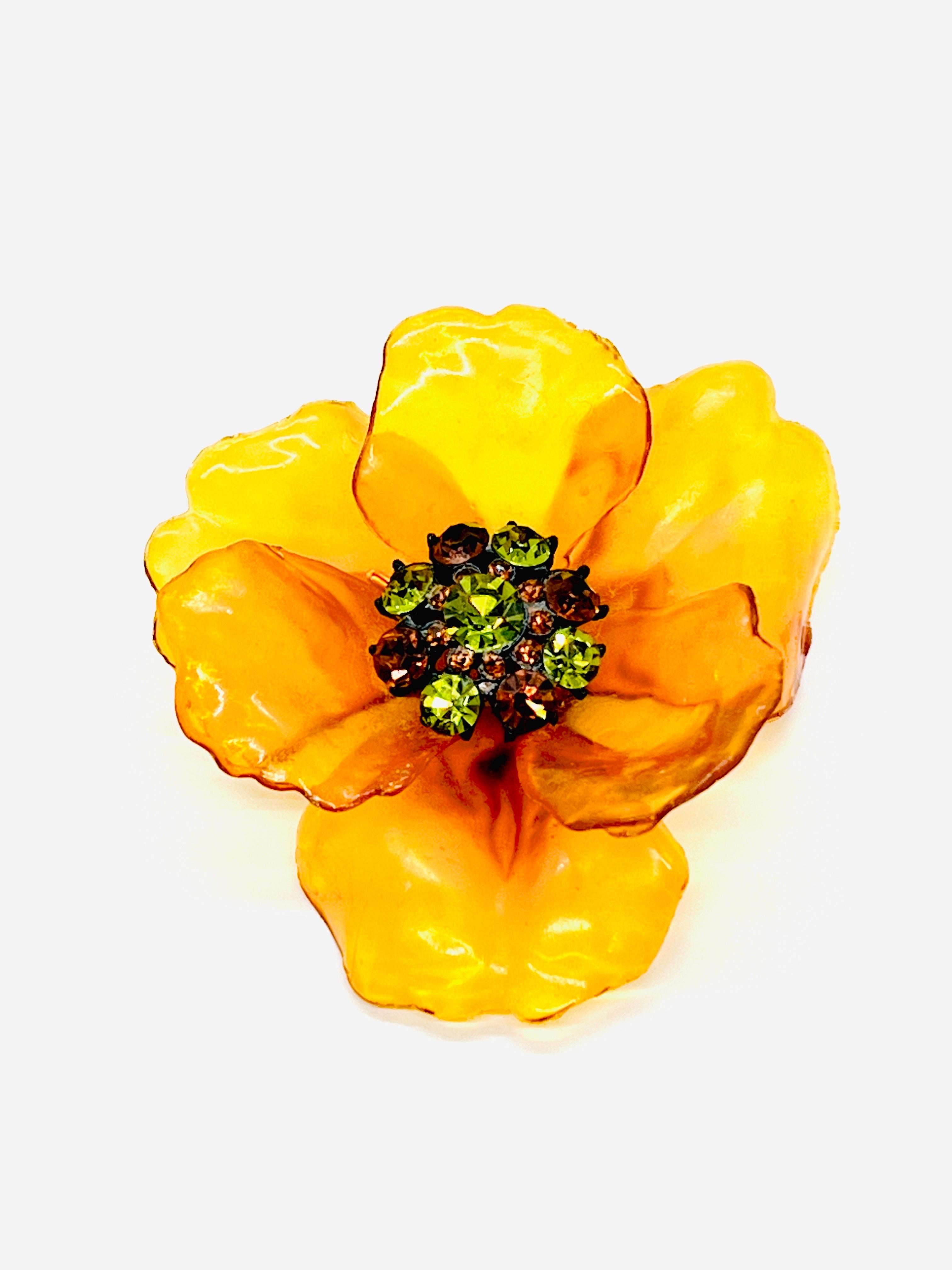Unmarked Vendome Honey Lucite, Six-Petal Flower Brooch, 1960s, Sparkling Brown and lime green diamond cut crystal rhinestone cluster with black metal details.  

This is a beautiful honey-colored lucite plastic flower power pin. It resembles an
