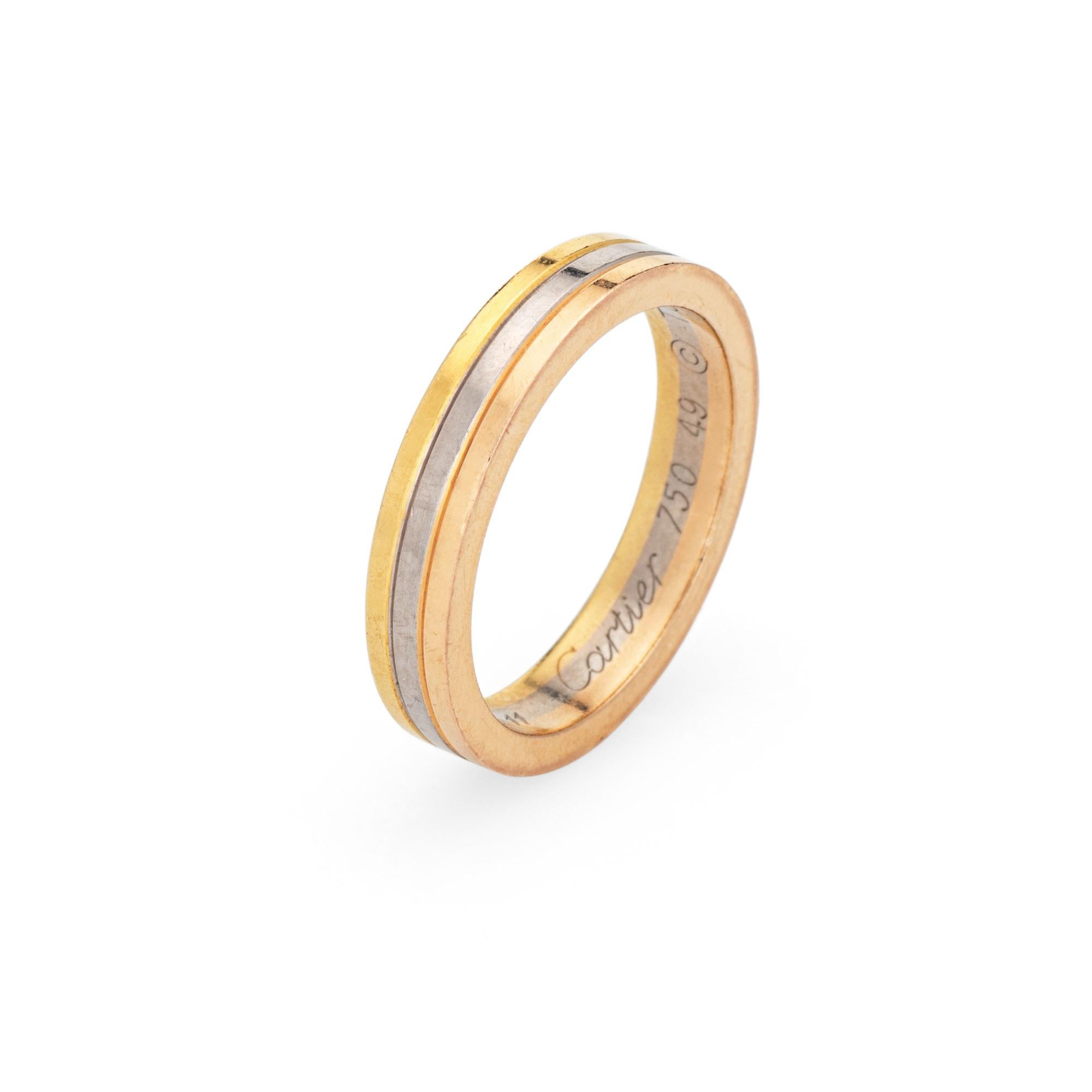 Pre-owned Vendome Louis Cartier wedding band crafted in 18k yellow, white & rose gold.  

The Cartier ring features bands of 18k rose, yellow & white gold. The 3.5mm wide ring is great worn alone or layered with your fine jewelry from any era. The