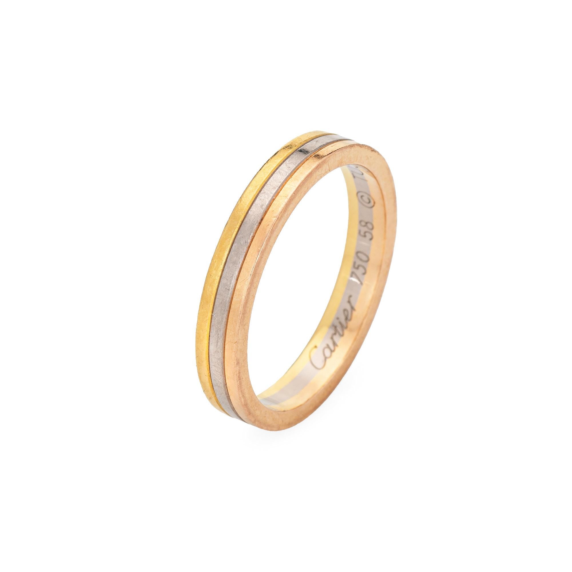 Pre-owned Vendome Louis Cartier wedding band crafted in 18k yellow, white & rose gold.  

The Cartier ring features bands of 18k rose, yellow & white gold. The 3.5mm wide ring is great worn alone or layered with your fine jewelry from any era. The