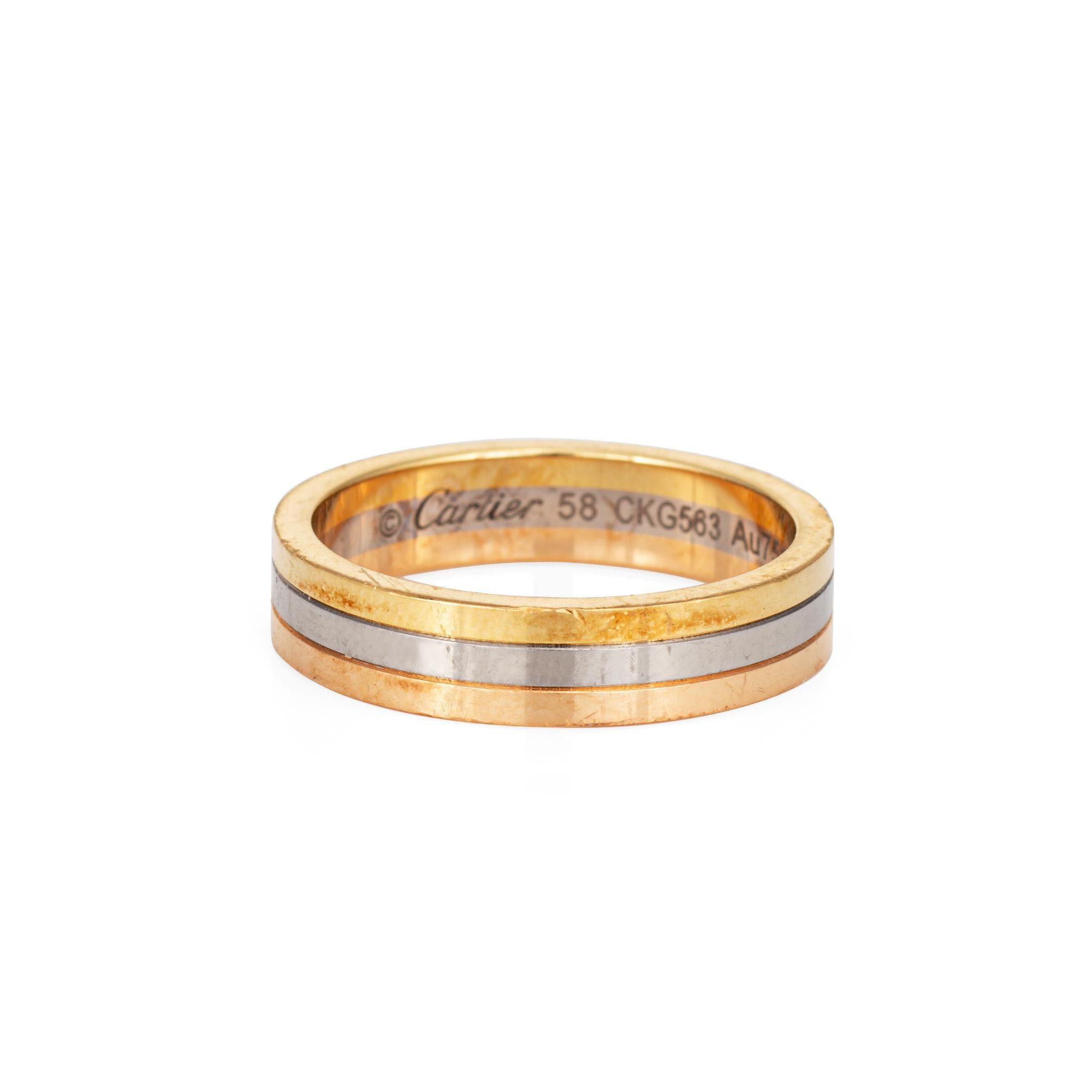 Pre-owned Vendome Louis Cartier wedding band crafted in 18k yellow, white & rose gold.  

The Cartier ring features bands of 18k rose, yellow & white gold. The 5mm wide ring is great worn alone or layered with your fine jewelry from any era. No box