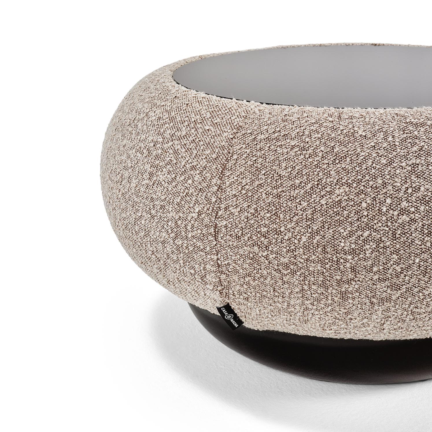 The round Vendôme coffee table is settled on an upholstered structure, allowing the use of custom fabrics.‎  Finished with a black glass on top which gives it a contemporary design.‎ Available with or without a lacquered base.‎ Can be used