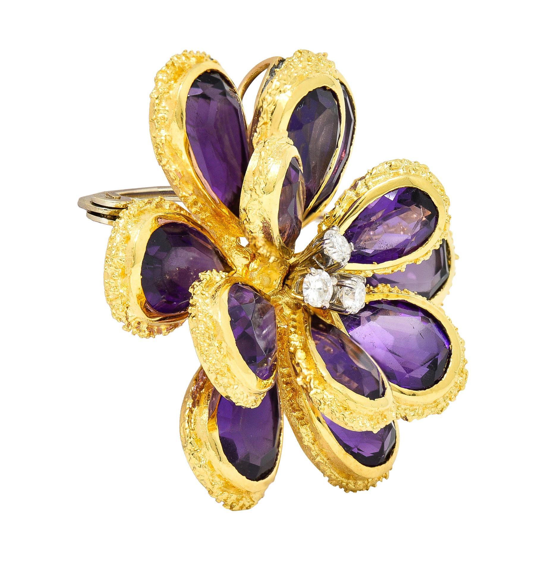 Designed as a flower with dimensional petals comprised of bezel set pear cut amethysts

Transparent purple in color with medium saturation - bezels feature organic texture surrounds

Centering round brilliant cut diamonds prong set in white