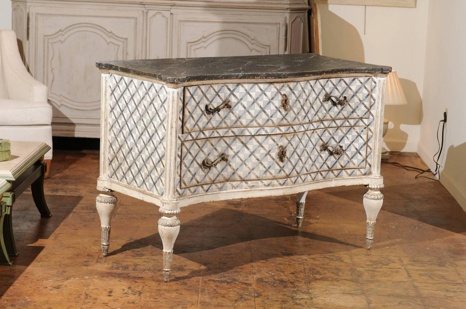 A pair of Venetian serpentine commode with hand-painted décor, silver gilt accents and marbleized top from the mid-19th century. Found in a villa in Venice, Italy, this pair of two drawer-commodes will make a statement in any room. Each commode