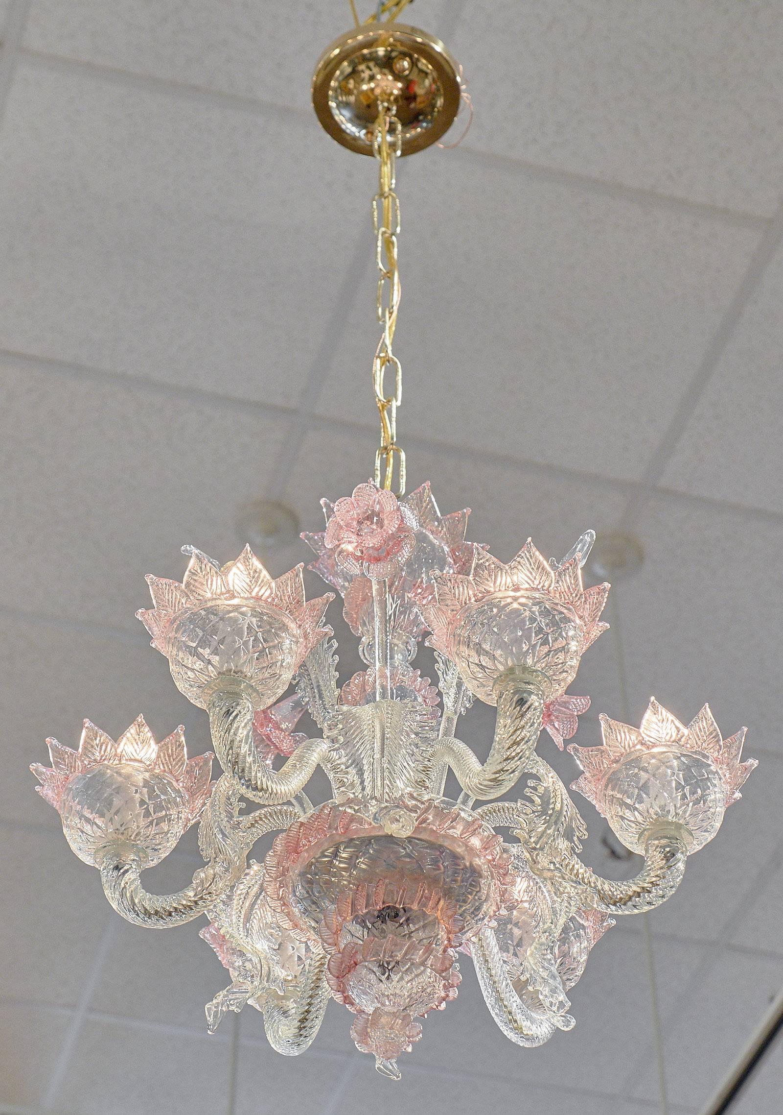 An antique Venetian chandelier in pink and clear crystal with six branches and leaves. This fixture has been wired to fit US standards.