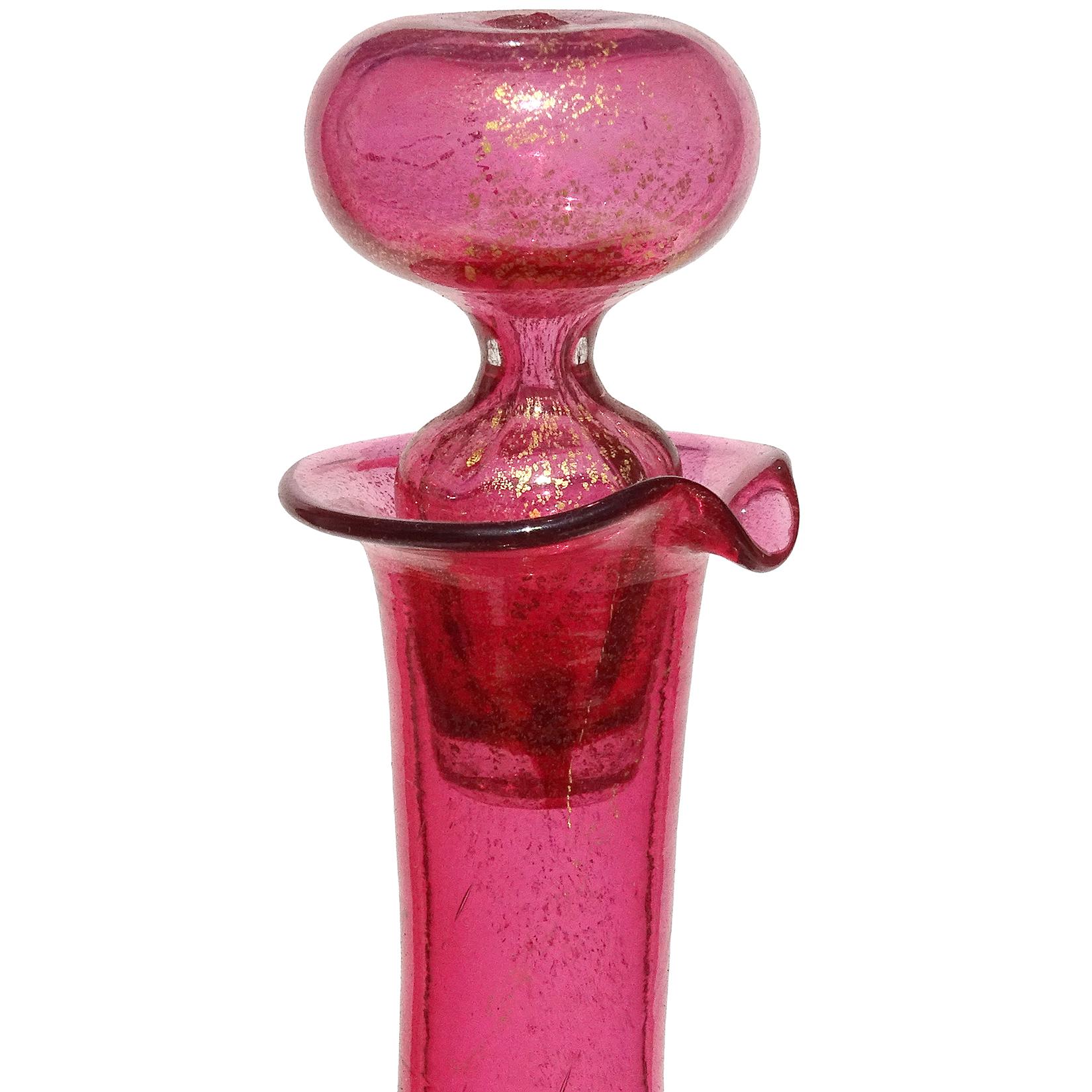Beautiful antique, early Venetian hand blown cranberry pink and gold flecks Italian art glass cruet with original stopper. Created in the manner of the Salviati company. The bottle is rounded, but dimpled on each side, making it an unusual squared