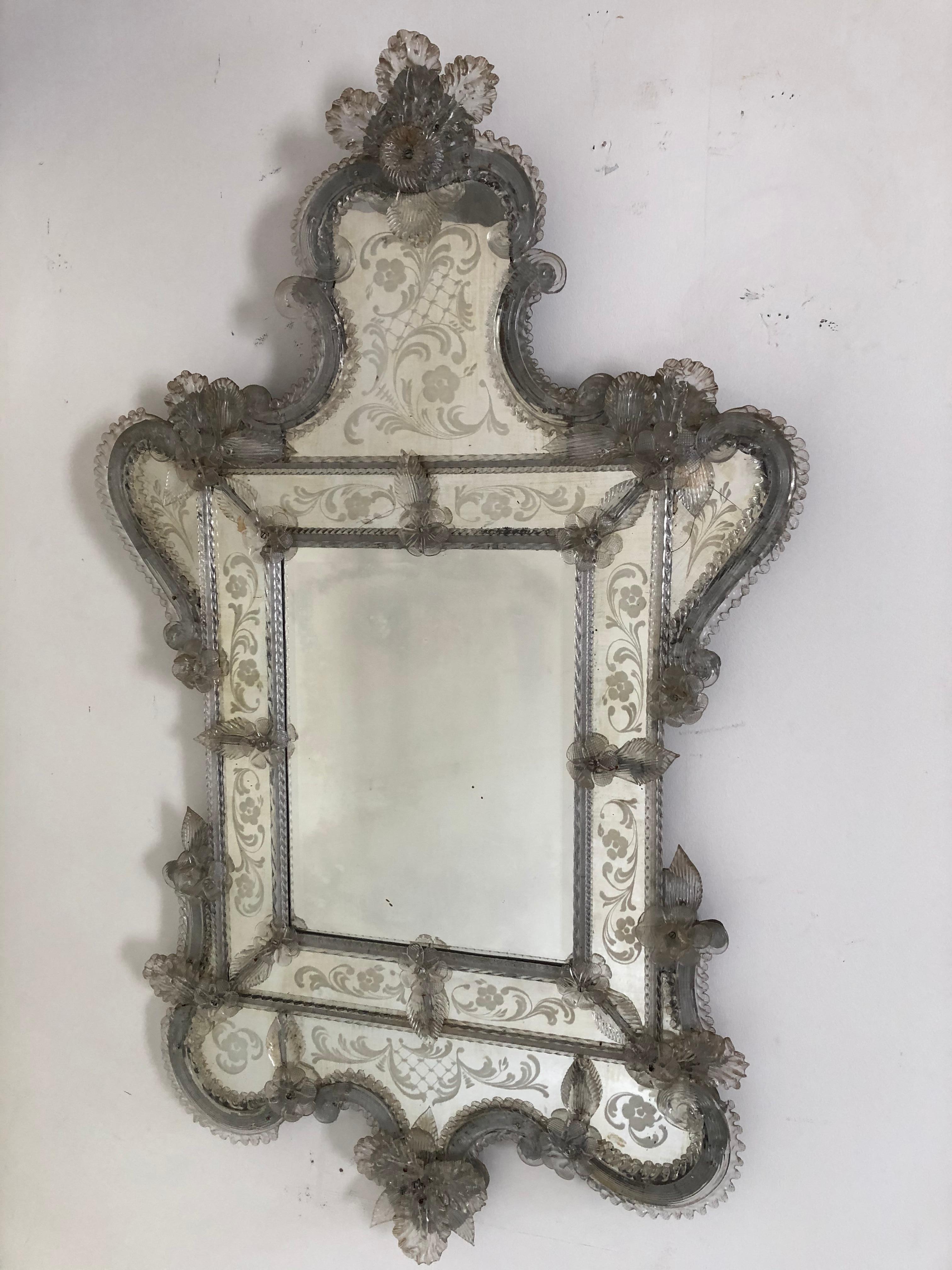 Antique Venetian etched and blown glass mirror, glass flowers and graceful curved shape and canopy decorative top, some distressing and small cracks to smaller panel.