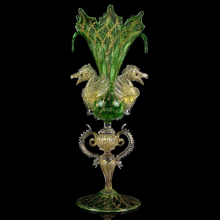 Early antique Venetian green and gold flecks Italian art glass double Pegasus horses flower vase. Attributed to the Artisti Barovier / Fratelli Toso companies, circa 1895-1914. The vase is very ornate with intricate cut and flared rim, and diamond