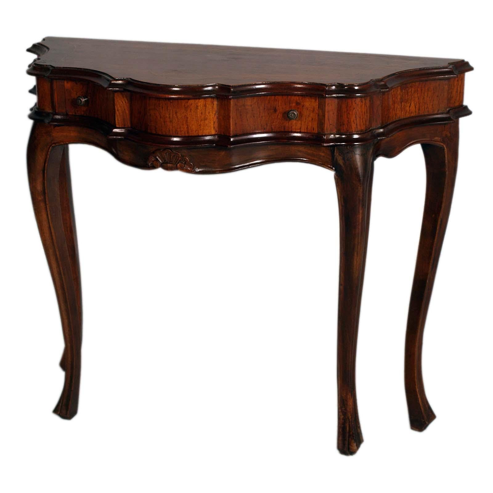 Venetian baroque console from the early 1900s in carved and inlaid walnut, wax polished
Elegant carved Venetian Baroque console with full-width drawer and inlaid top. With excellent patina

About Bassano's Ebanistery
The Bassano del Grappa area, up