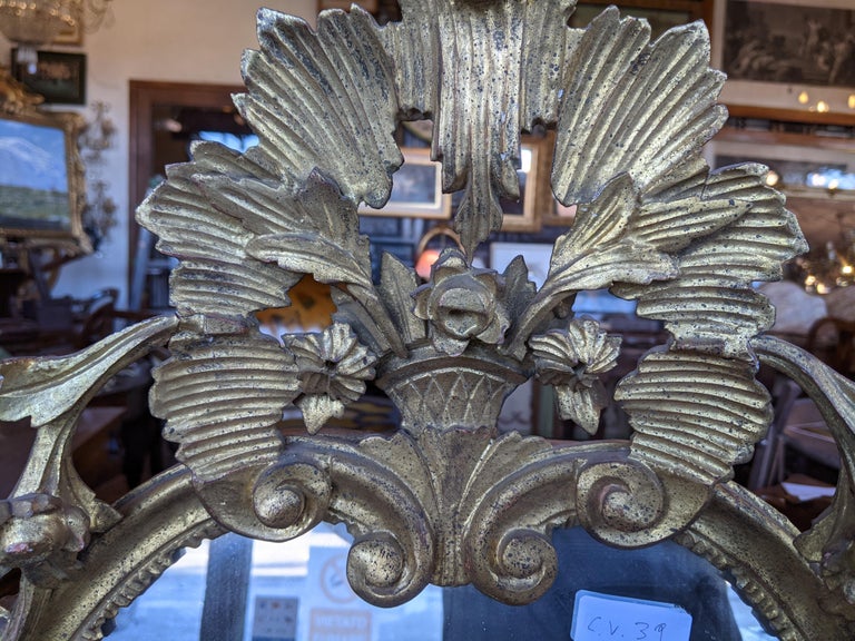 Authentic mirror of the Venetian Baroque period, hand carved and finished with gold leaf.

Please note that all of our items are shipped after a microwave woodworm treatment, grouting woodworm holes and a deep cleaning and polishing with virgin