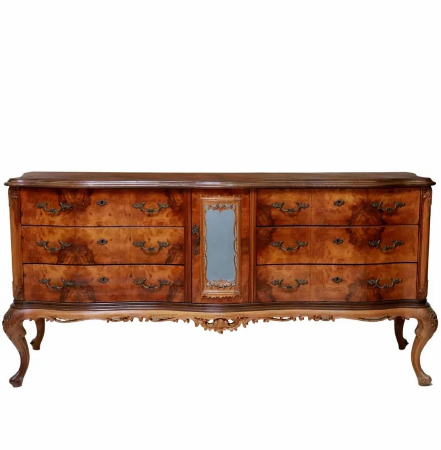A stunning grand Italian midcentury Venetian Baroque patchwork burlwood sideboard.

Exquisitely handcrafted of warm richly figured burled walnut, born in the Veneto region of Northeastern Italy, circa 1940s, featuring a visually striking