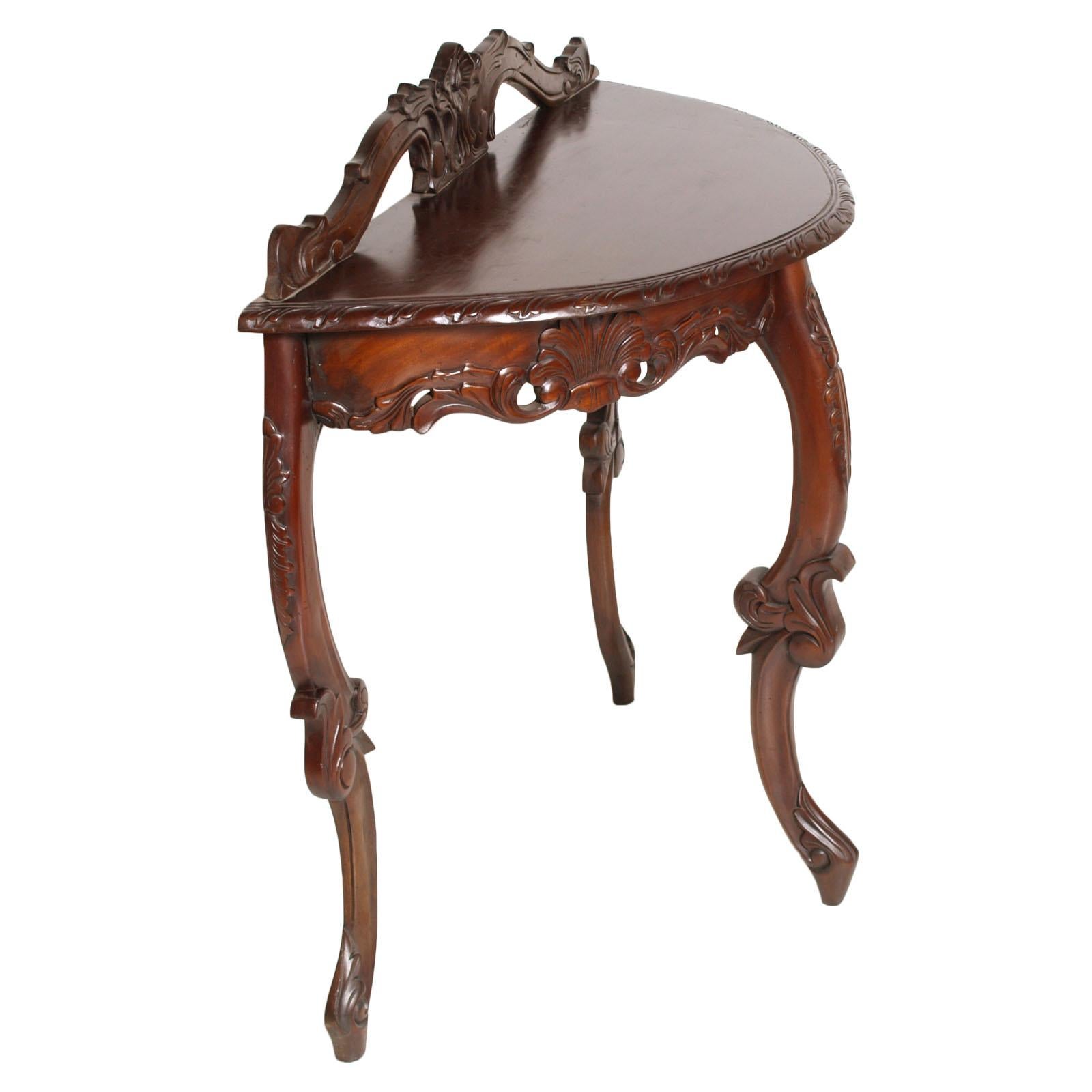 Italian Venetian Liberty console, demilune table, Eugenio Quarti designer attributable in hand carved solid mahogany, restored and wax-polished, circa 1900s. From Hungaria Palace Hotel -Lido di Venezia

Measures cm: H 88, W 90, D 42


About Eugenio