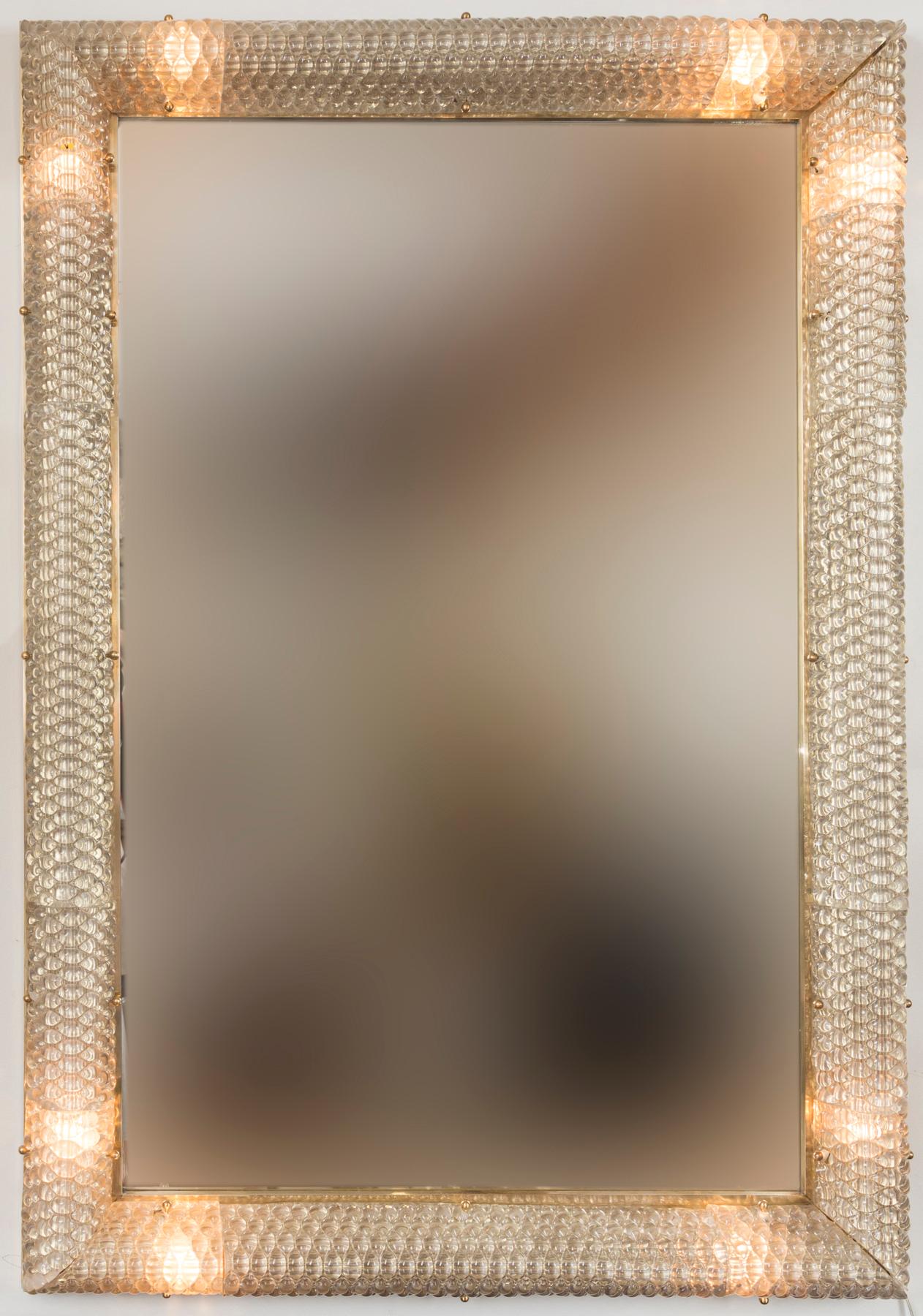 Shimmery blown taupe colored glass placed into textured molds to form a beveled framed mirror that can also illuminate, electrified to US standards with US porcelain interior sockets, beautiful on or off.  Electrified to US standards with US
