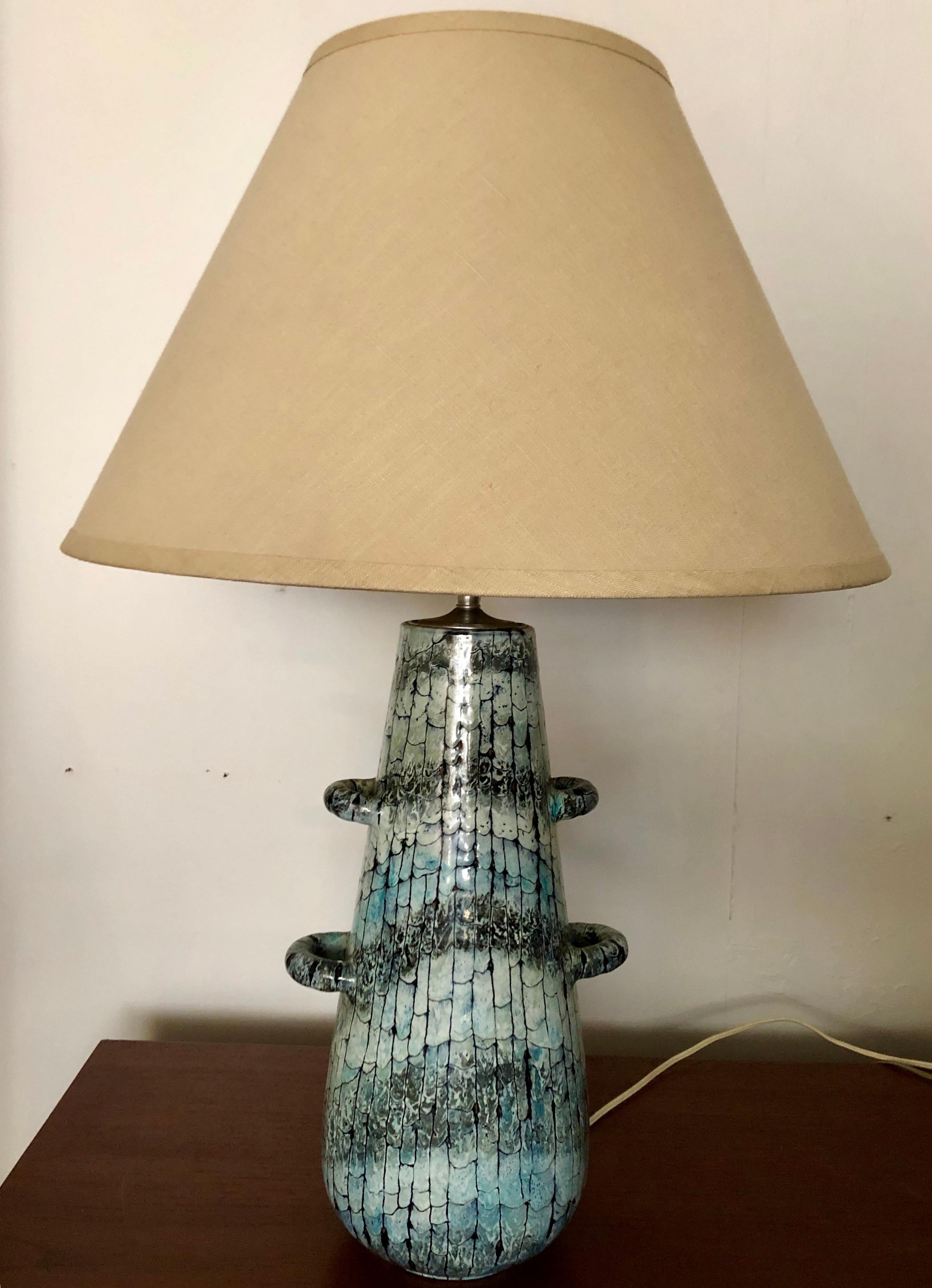 Italian pottery lamp with 4 handles and interesting scalloped faux-craquelure glaze in varying shades of blue/green/charcoal gray. Base is 16