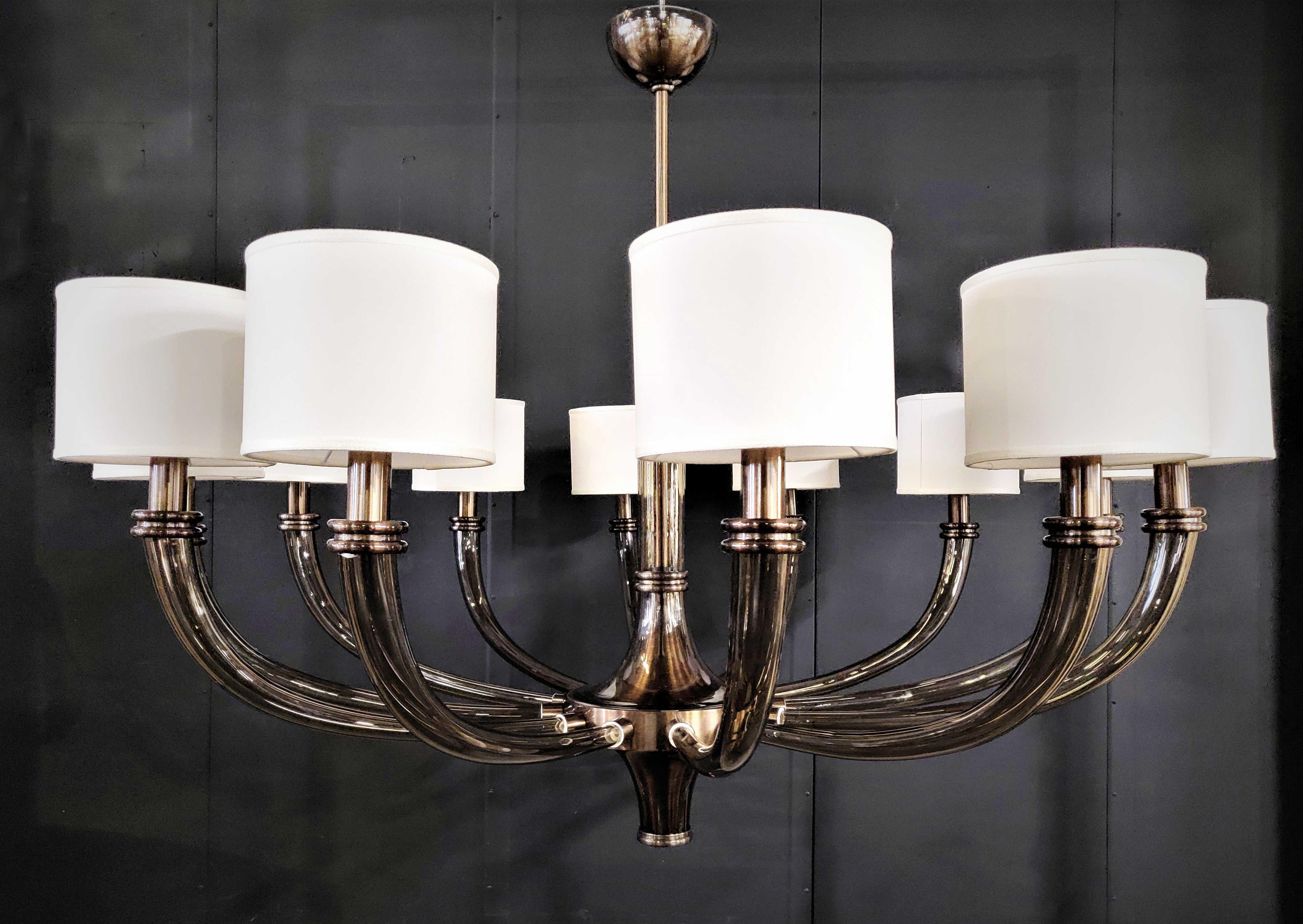 Italian 12-arm Venetian chandelier with smoky brown Murano glass in oil rubbed bronze finish and fabric shades / Made in Italy
12 lights / E26 or E27 type / max 60W each
Measures: Diameter: 51 inches / Height: 36 inches 
Order only / This item ships