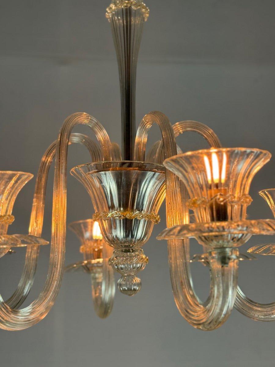 Venetian Chandelier In Colorless And Golden Murano Glass

6 arms of light

New electrification

Circa 1940