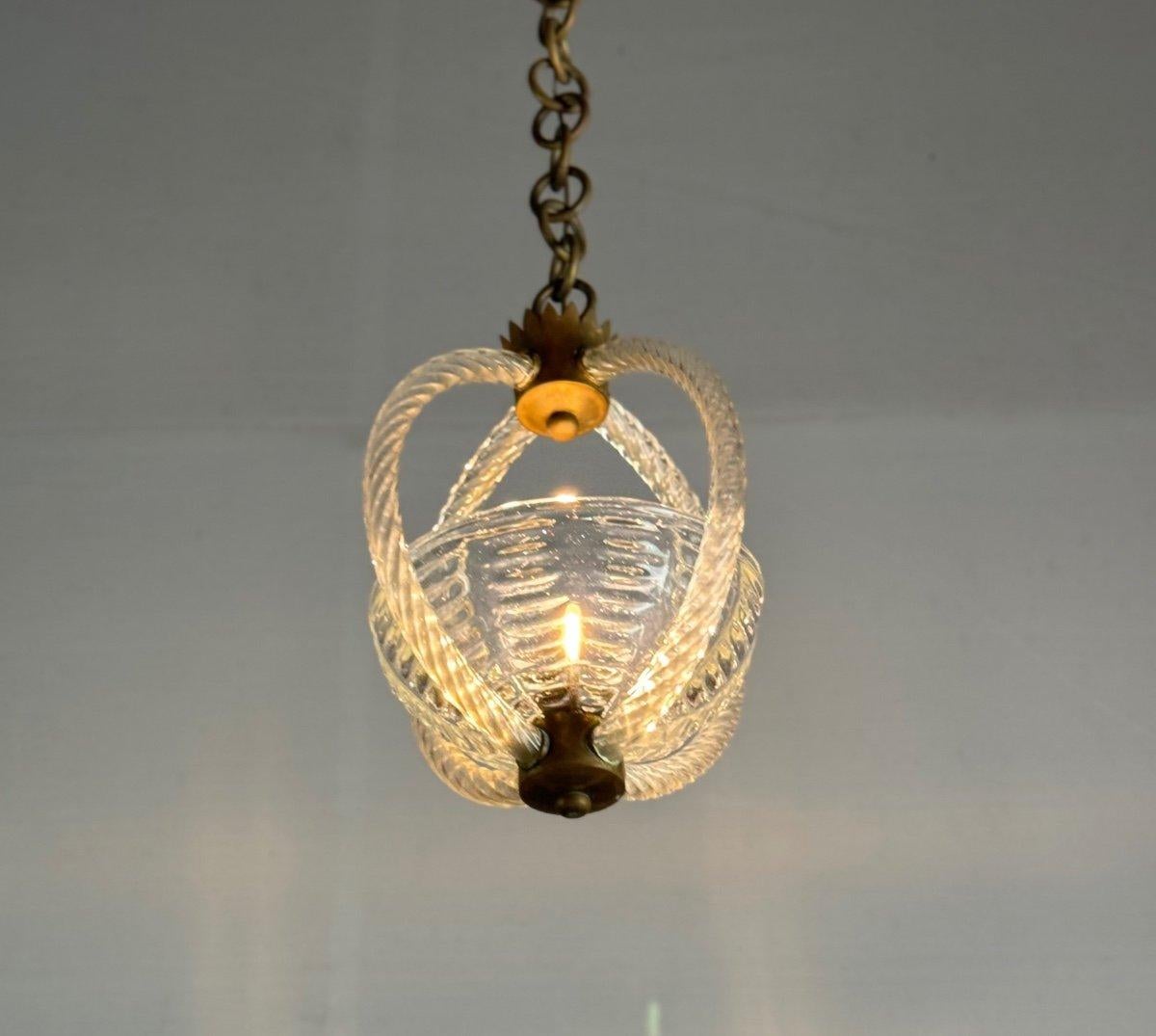 Lampadario veneziano in vetro di Murano incolore CIRCA 1950

40 cm solo per il lampadario, 90 cm con la catena.