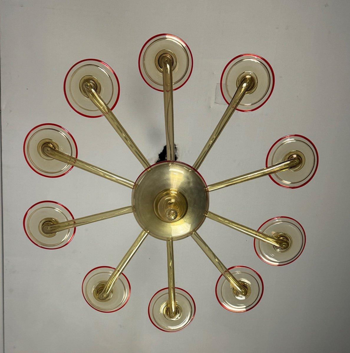 Metal Venetian Chandelier In Mordore Murano Glass Highlighted With A Red Lining For Sale