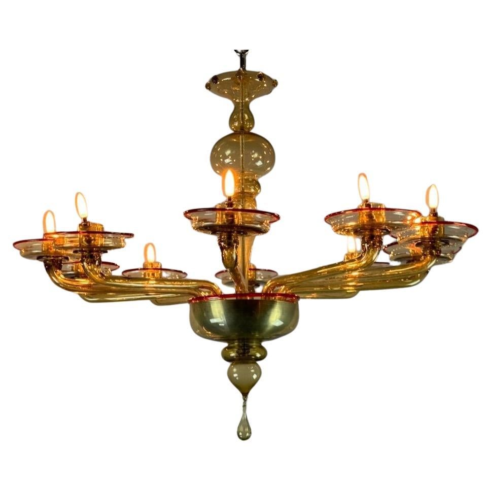 Venetian Chandelier In Mordore Murano Glass Highlighted With A Red Lining For Sale