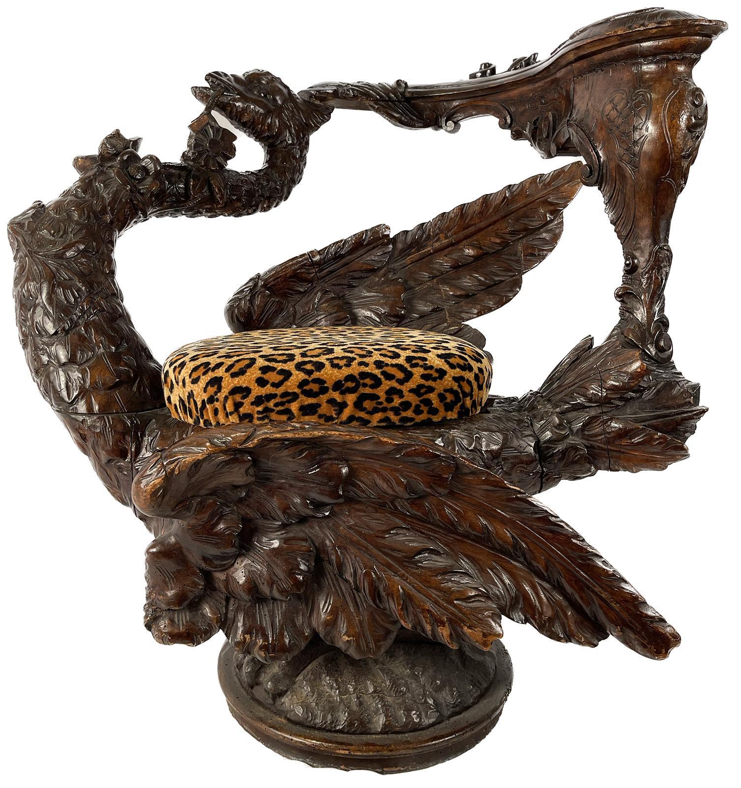 A Venetian style carved crane stool with a velvet leopard cushion.

Dimensions: 27
