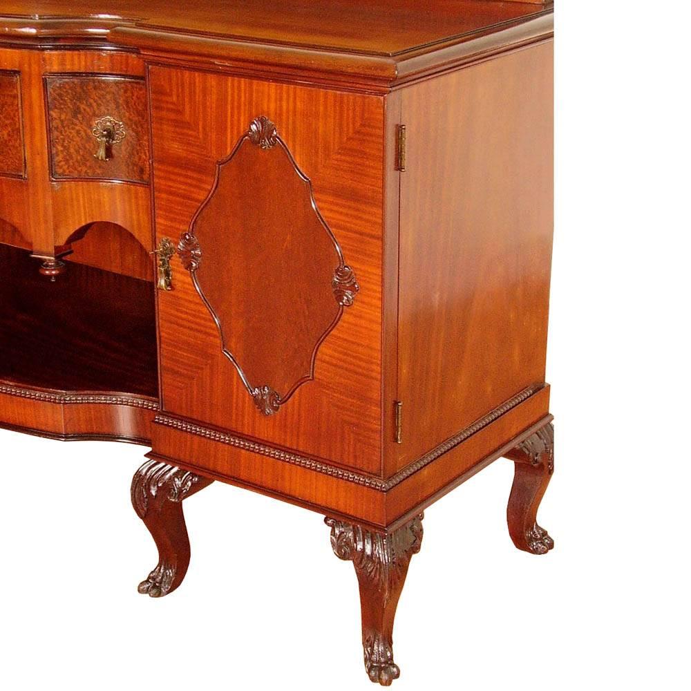 1920s precious and refined Venetian eclectic mirrored credenza sideboard by Testolini & Salviati.
Sideboard splendid in all its parts with three central drawers and two side compartments with central shelf. Bevelled mirror with beautiful hand-carved