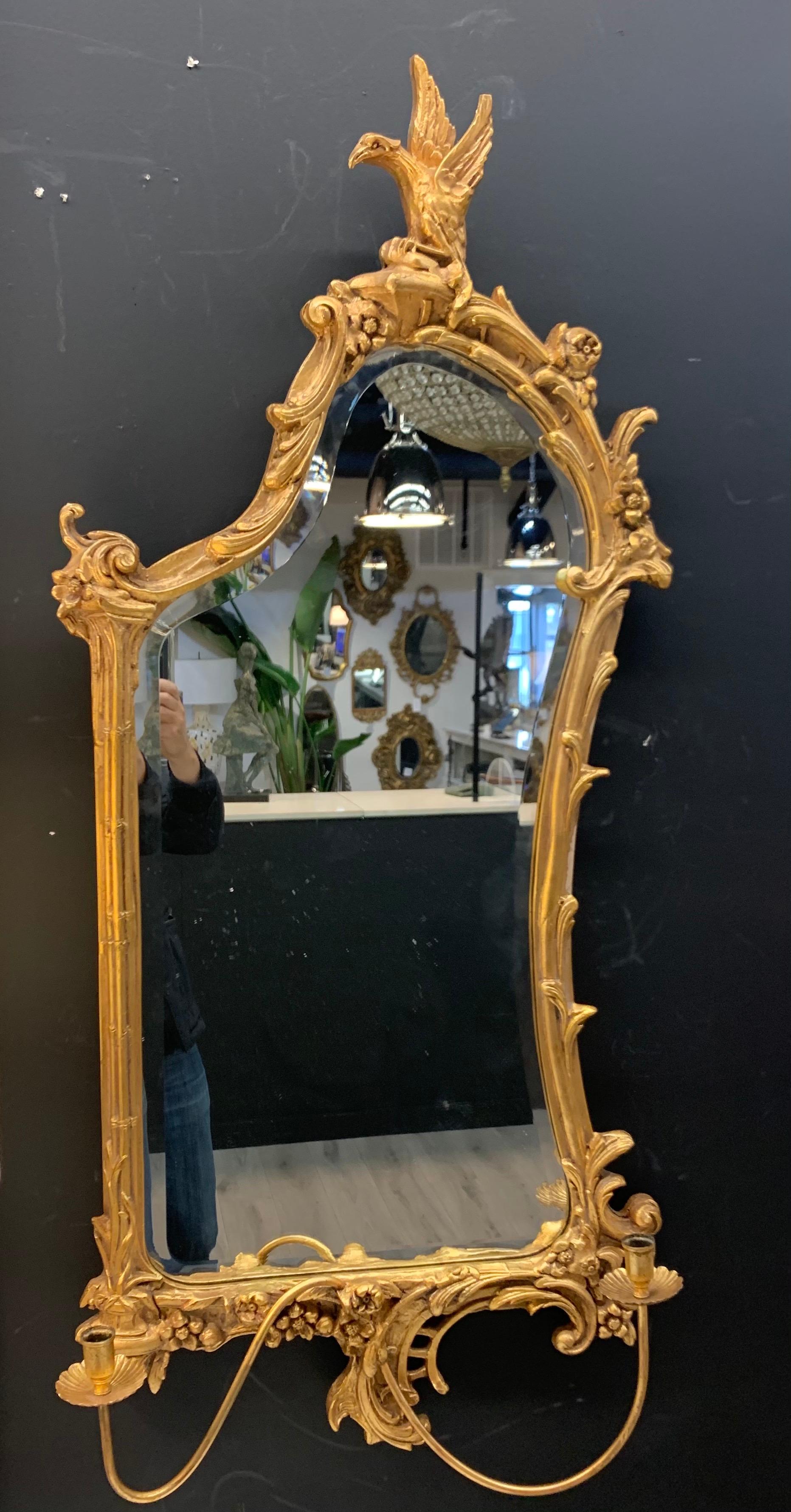 The mirror was likely made in the early part of the 20th century but in the same Italian region, and appear to have a more Japanese influence in their design especially the hawk/eagle leaning over the top of the mirror. The giltwood frame of the