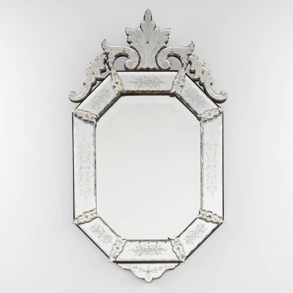 Venetian etched and cut-glass Vintage Wall Mirror

Anonymous
Venice, Italy; early 20th century
Etched glass, mirroring, wood backing

Approximate size: 22.75 (w) x 39.25 (h) in.

A beautiful and elegant elongated octagonal faceted Venetian mirror