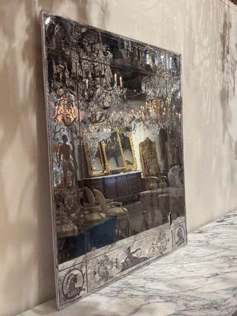 19th century Venetian etched glass mirror with figures. Looking to add a touch of old-world glamour to your space? Venetian etched glass mirrors are a stunning blend of artistry and elegance, often featuring intricate floral motifs, scalloped edges,