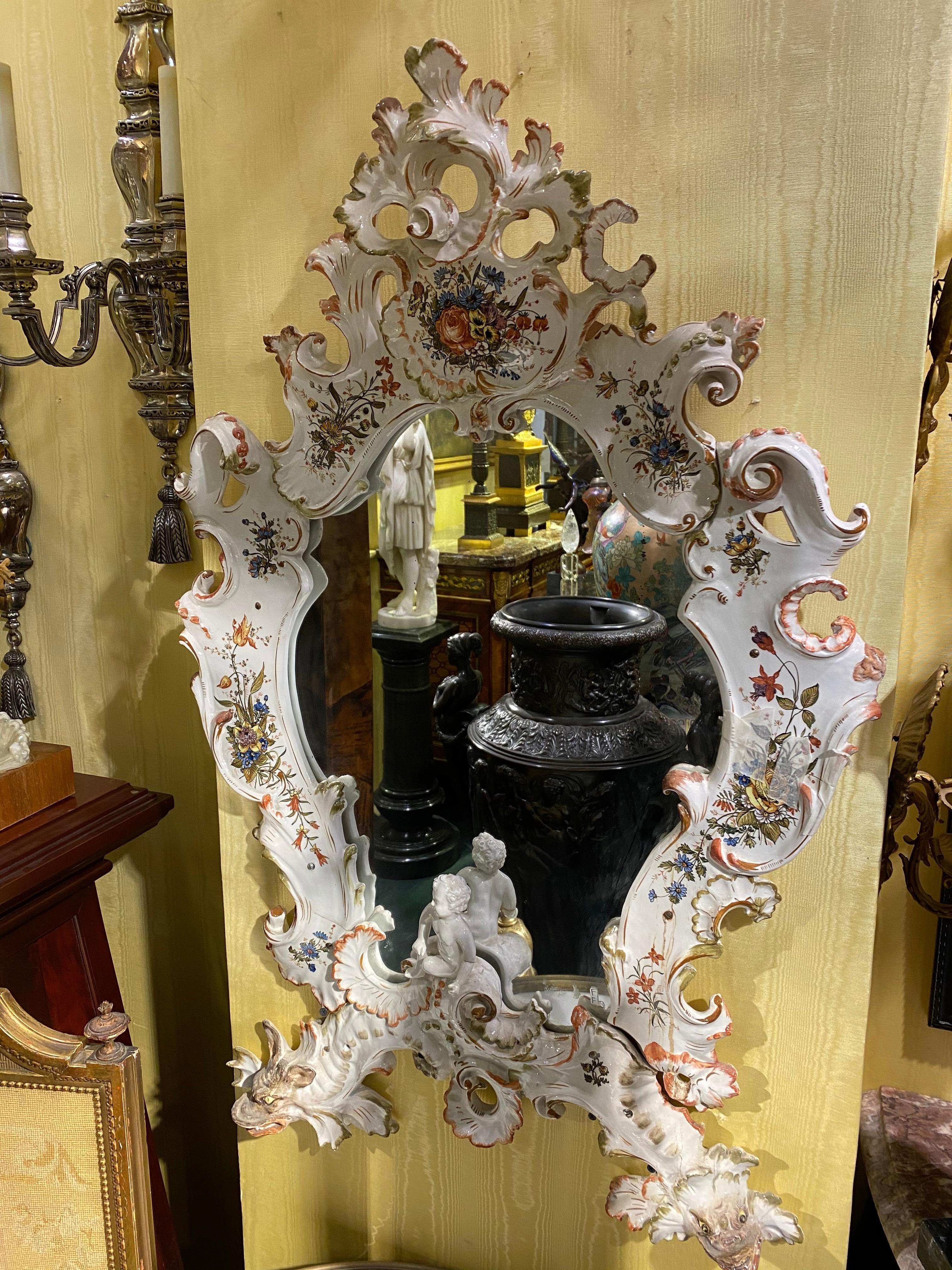 A Venetian floral painted porcelain mirror.
Stock number: M4.