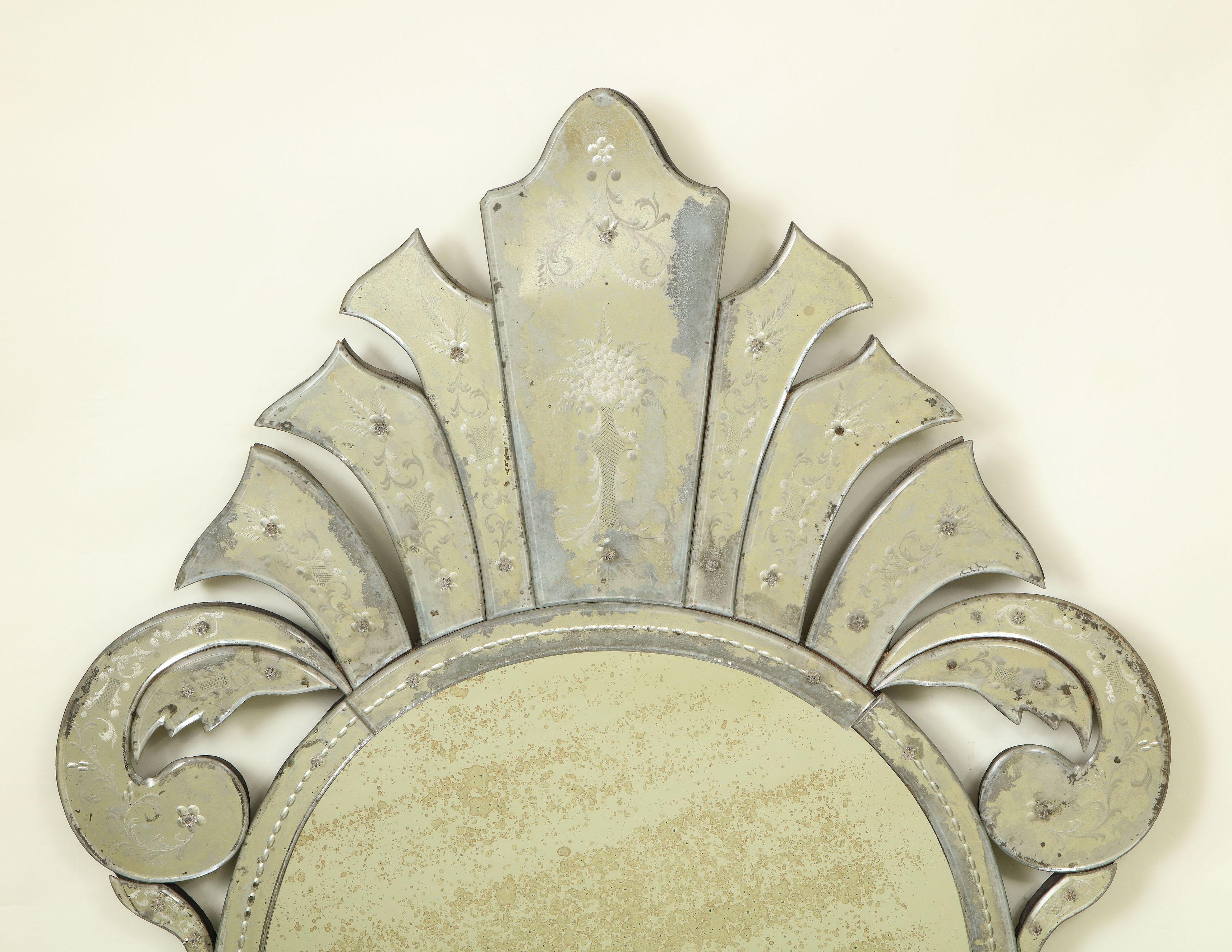 Impressive piece. The round central antiqued mirror plate with arched mirrored cresting and apron finely etched with foliate scrollwork with mirrored floral overlays.

Provenance: From the Collection of Mario Buatta, New York, NY.