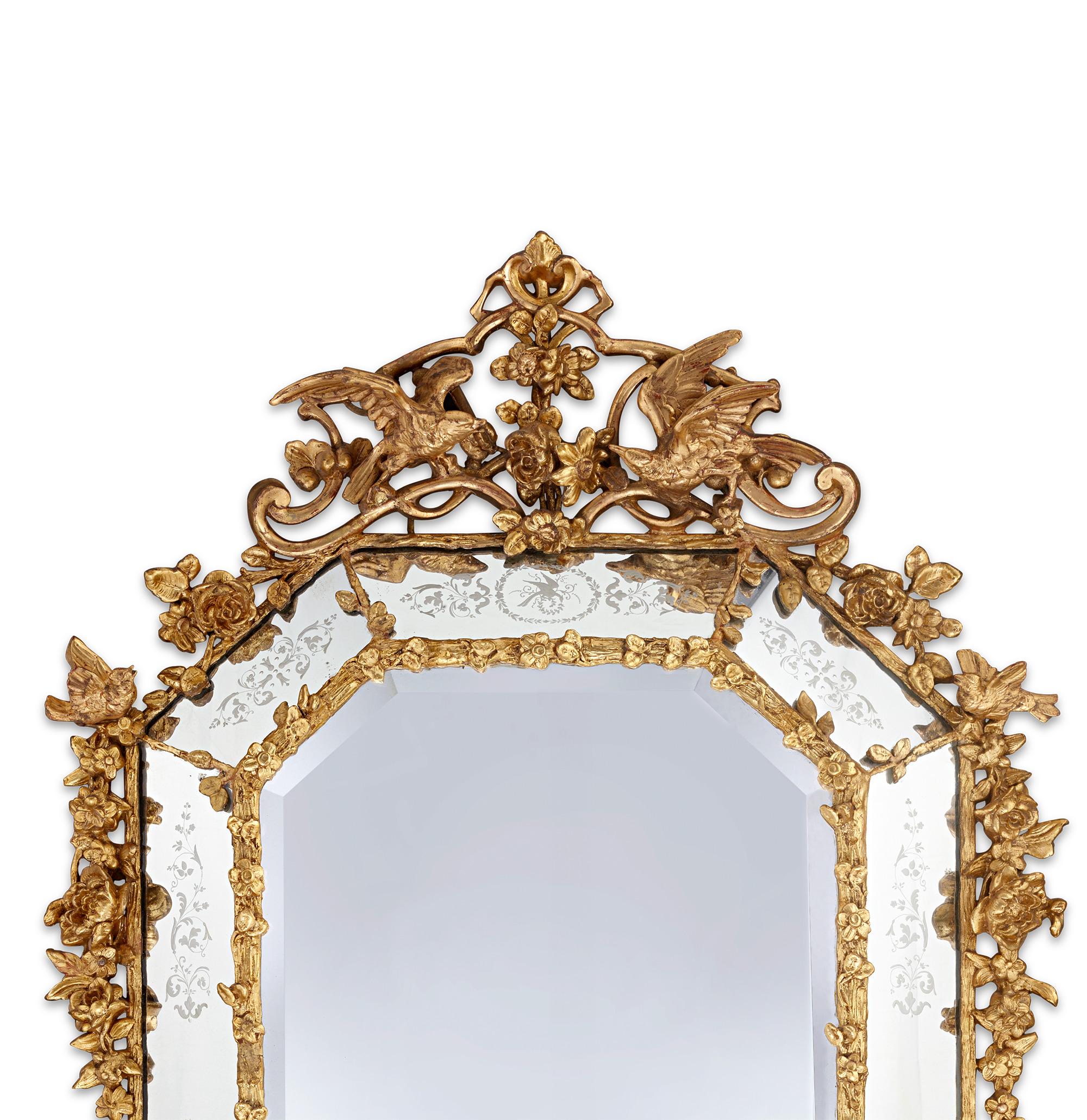 Venetian Gold Leaf Mirror
18th Century

This extraordinary mirror represents the pinnacle of 18th-century decorative arts, showcasing the craftsmanship for which Venetian artisans were renowned. The exquisite gilt wood frame features an elaborate