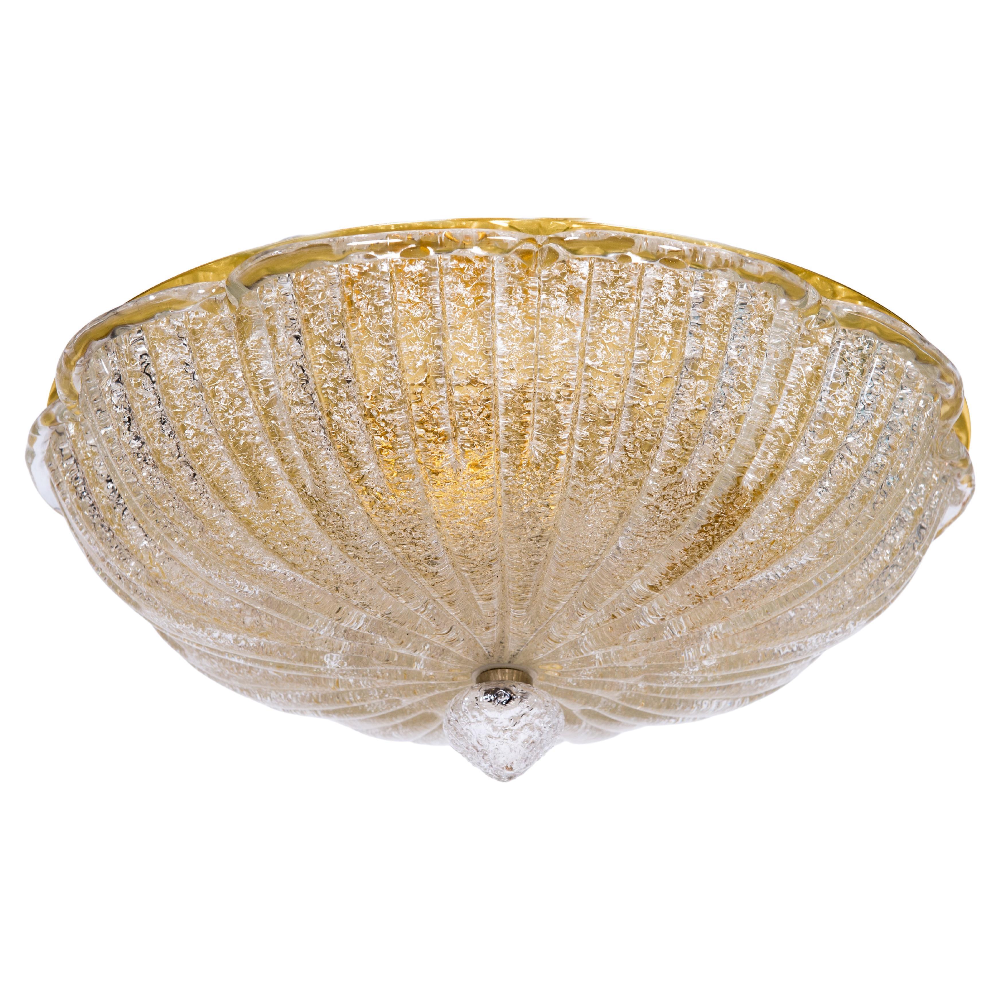 Venetian Grit Flush Mount Ceiling Light in Submerged Gold Murano Glass, 1980s
This exquisite flush mount ceiling light showcases the finest craftsmanship of Murano glass. Created in the Venetian island of Murano during the 1980s, this piece features