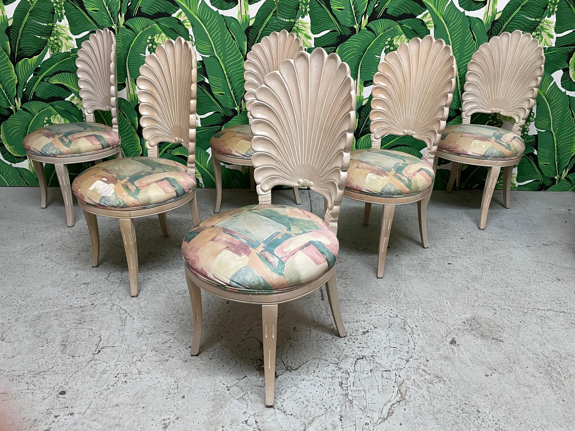 Set of six solid wood carved dining chairs in the Italian grotto style feature shell design and upholstered seats. Four side chairs and two arm chairs. Frames in very good condition with only minor imperfections consistent with age, upholstery shows
