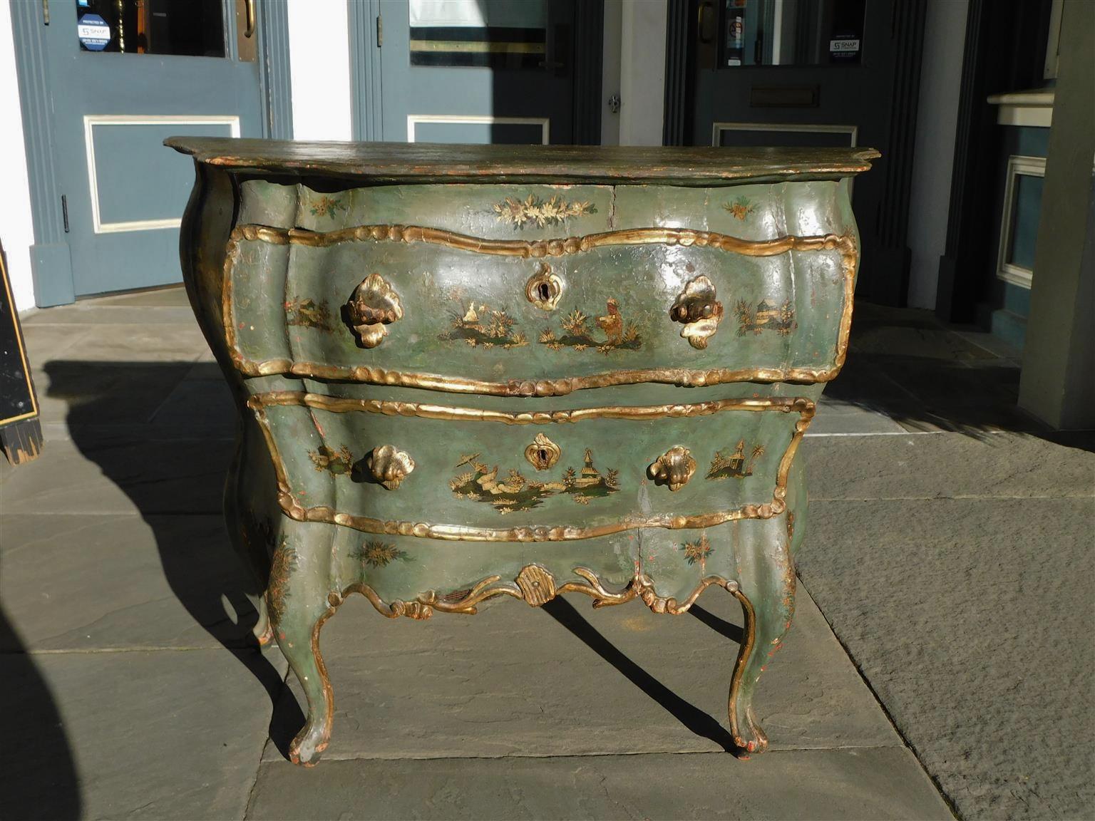 Venetian hand painted and gilt figural pagoda two-drawer commode with scalloped edge top, gilt carved shell form handles, and resting on a scalloped edge floral skirt with the original cabriole legs, Late 18th Century.