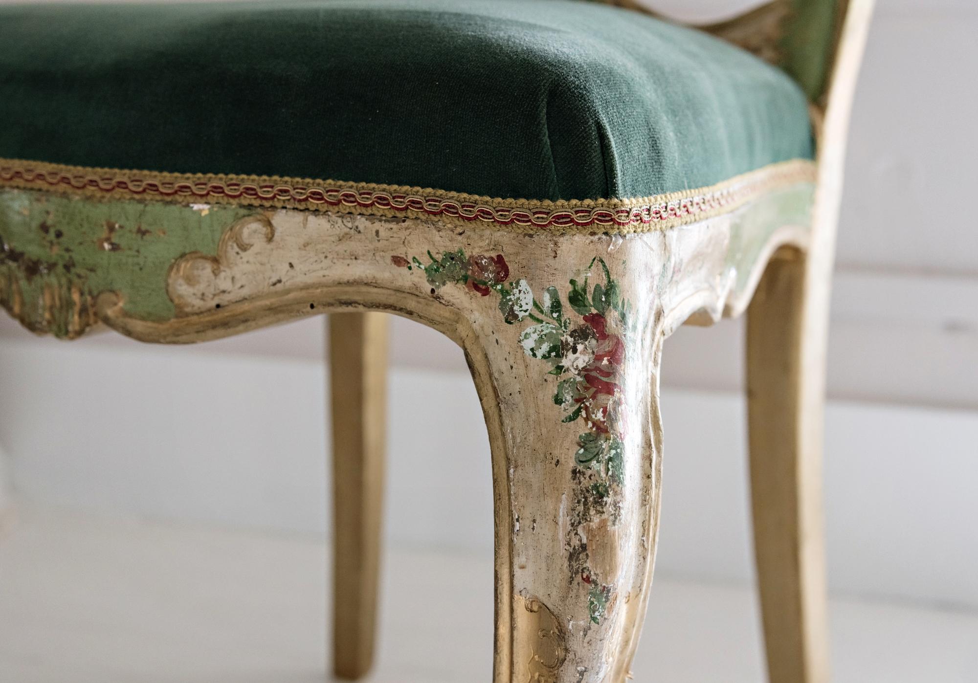 Elegant Venetian chair with carved, lacquered, gilded and hand painted wood with floral decorations.