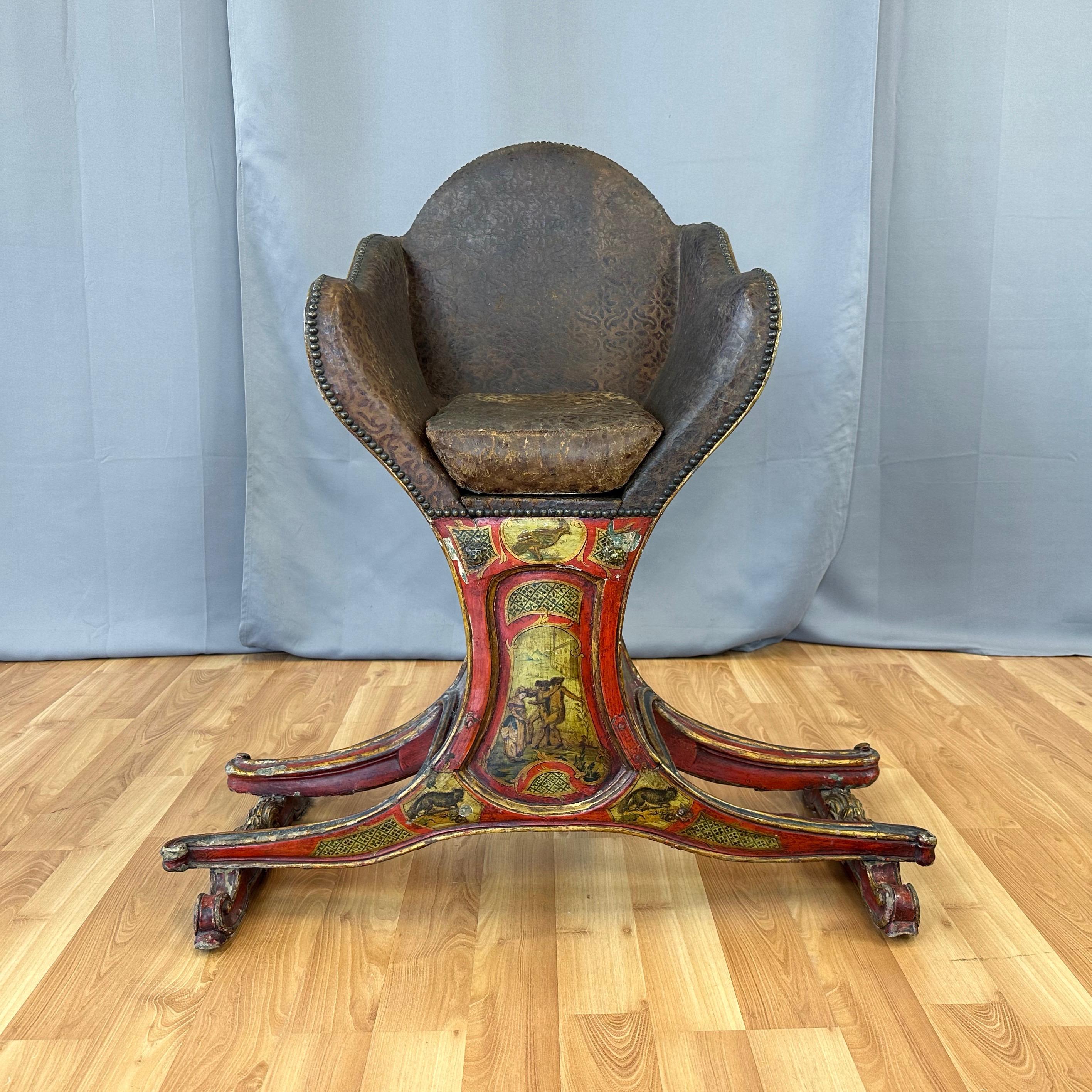 An absolutely stunning and rare circa 1820 museum-worthy Venetian gondola chair with illustrated panels, polychrome finish, parcel-gilt decorations, and original leather upholstery. Presented in its extraordinarily well-preserved and unaltered