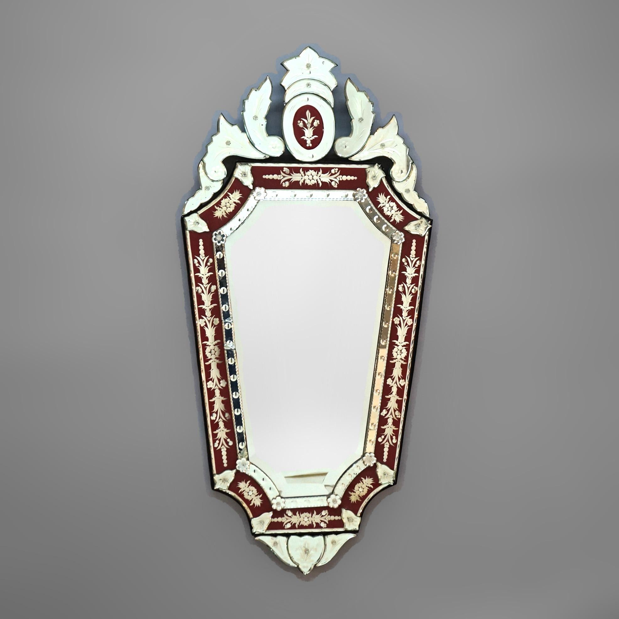 A Venetian Italian Renaissance wall mirror offers stylized shield form with a foliate form crest over polychrome and etched glass mirror, 20th century

Measures - 48