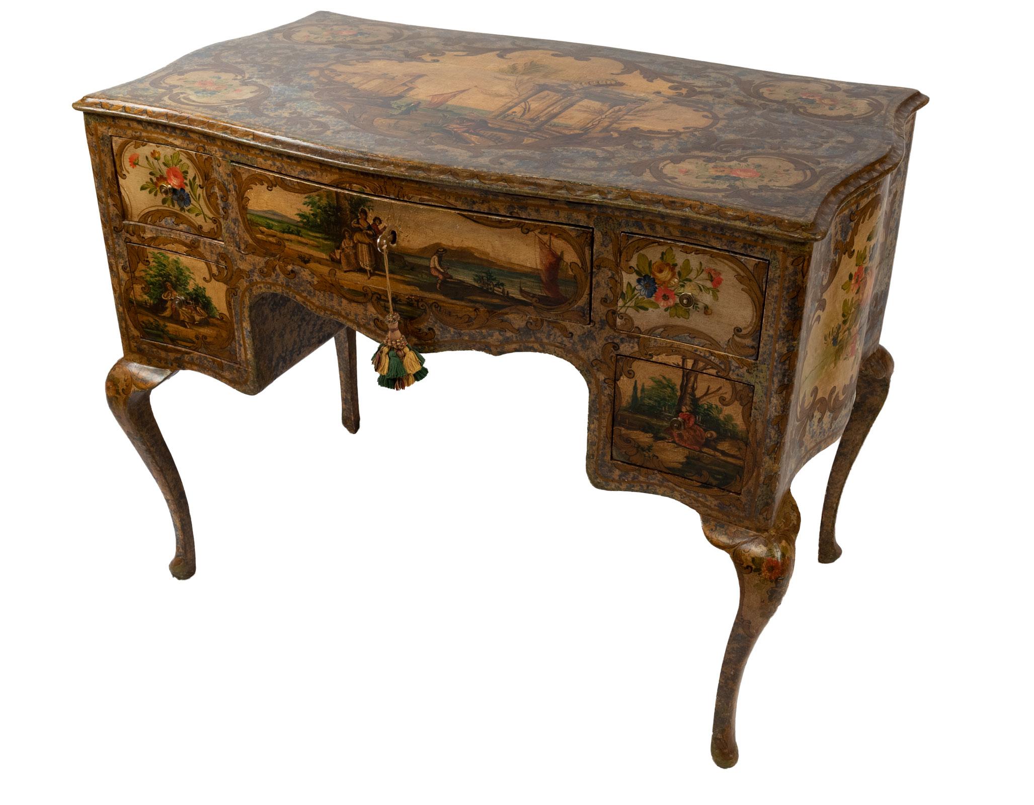 A Venetian knee-hole desk with cabriole legs, painted with scenes of country life, and Grand Tour ruins.