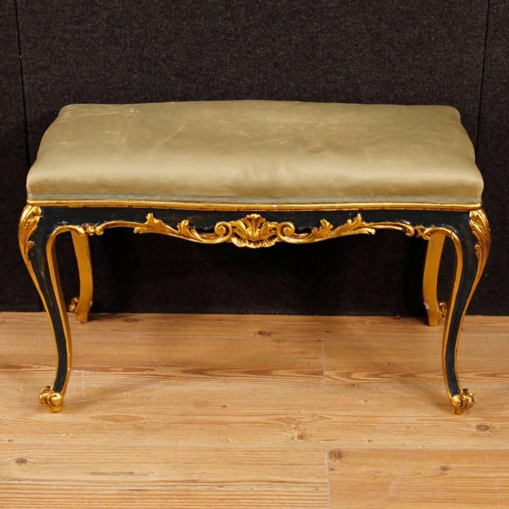 Venetian bench from 20th century. Nicely carved, lacquered and gilded wooden furniture of beautiful decoration. Stool covered in green fabric with some stains and signs of wear, to be replaced. Pleasant decor furniture ideal to be placed in a
