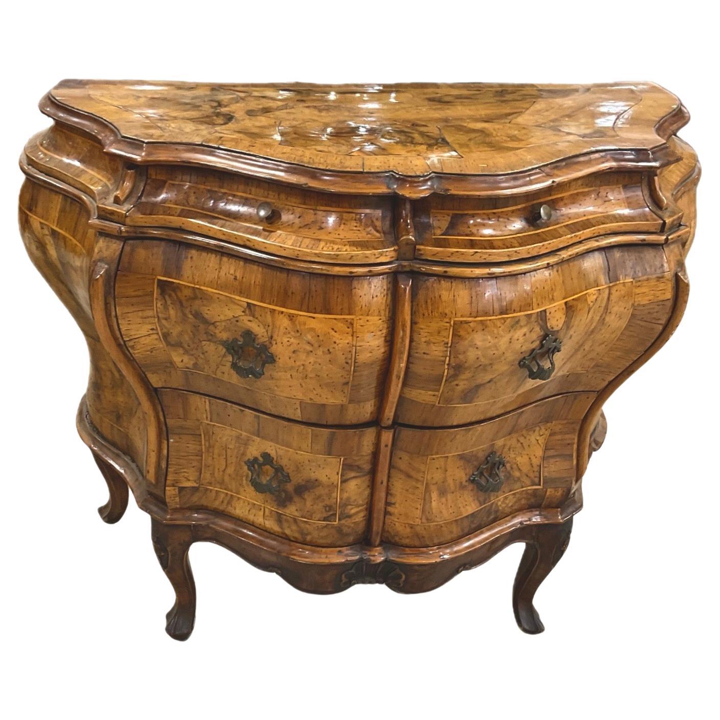 19th Century Walnut Venetian Louis XIV Burl Walnut Bombe Chest. Chest features two small upper drawer and two larger lower drawers with antique hardware. Chest has bombay front curving outward at sides and front adding a sense of opulence and