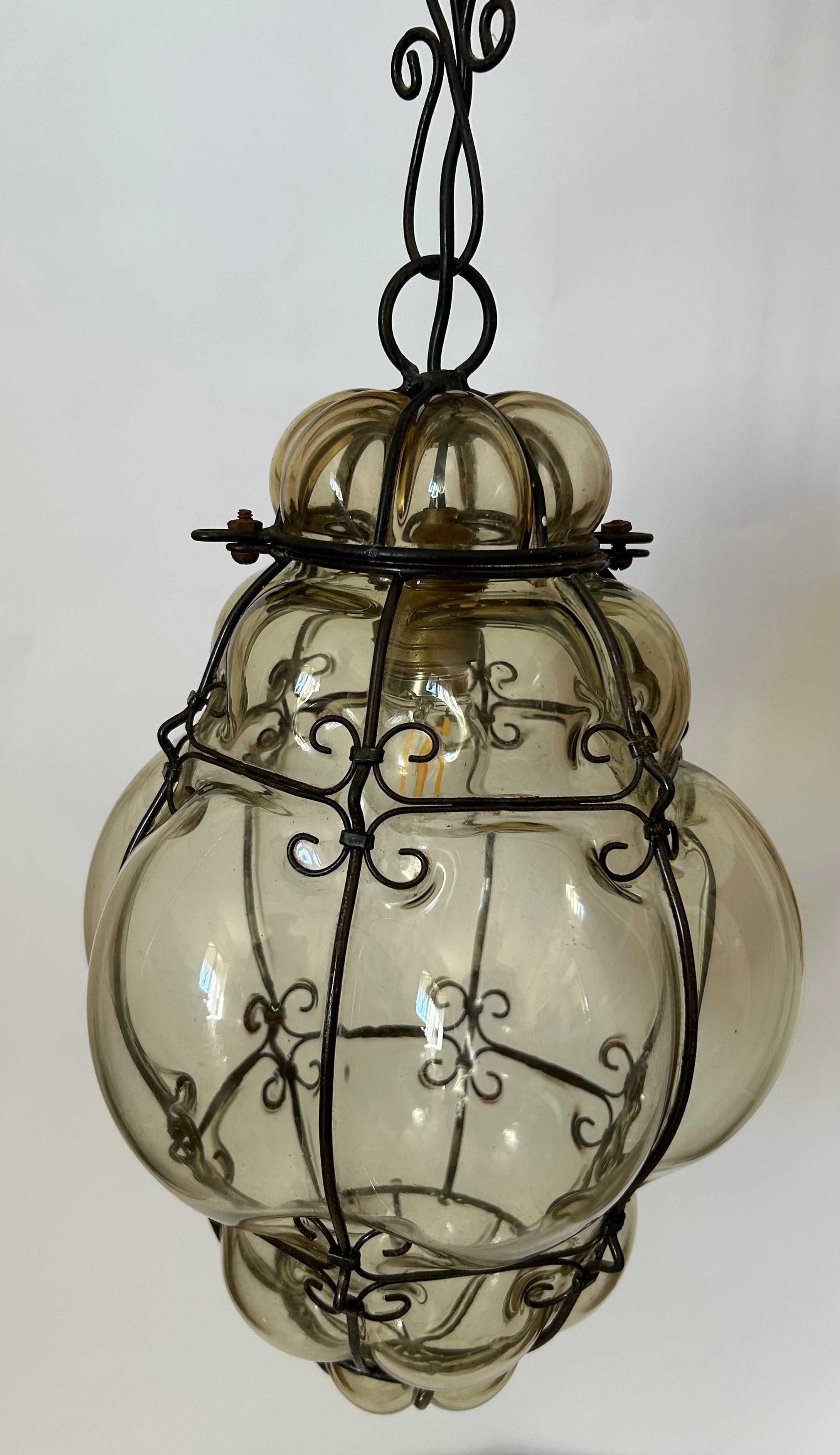 Venetian Murano Glass Lanterns. The glass is in excellent condition.  The hight indicated in the dimensions section includes the chain. The hight of the glass part only is 30 cm. 