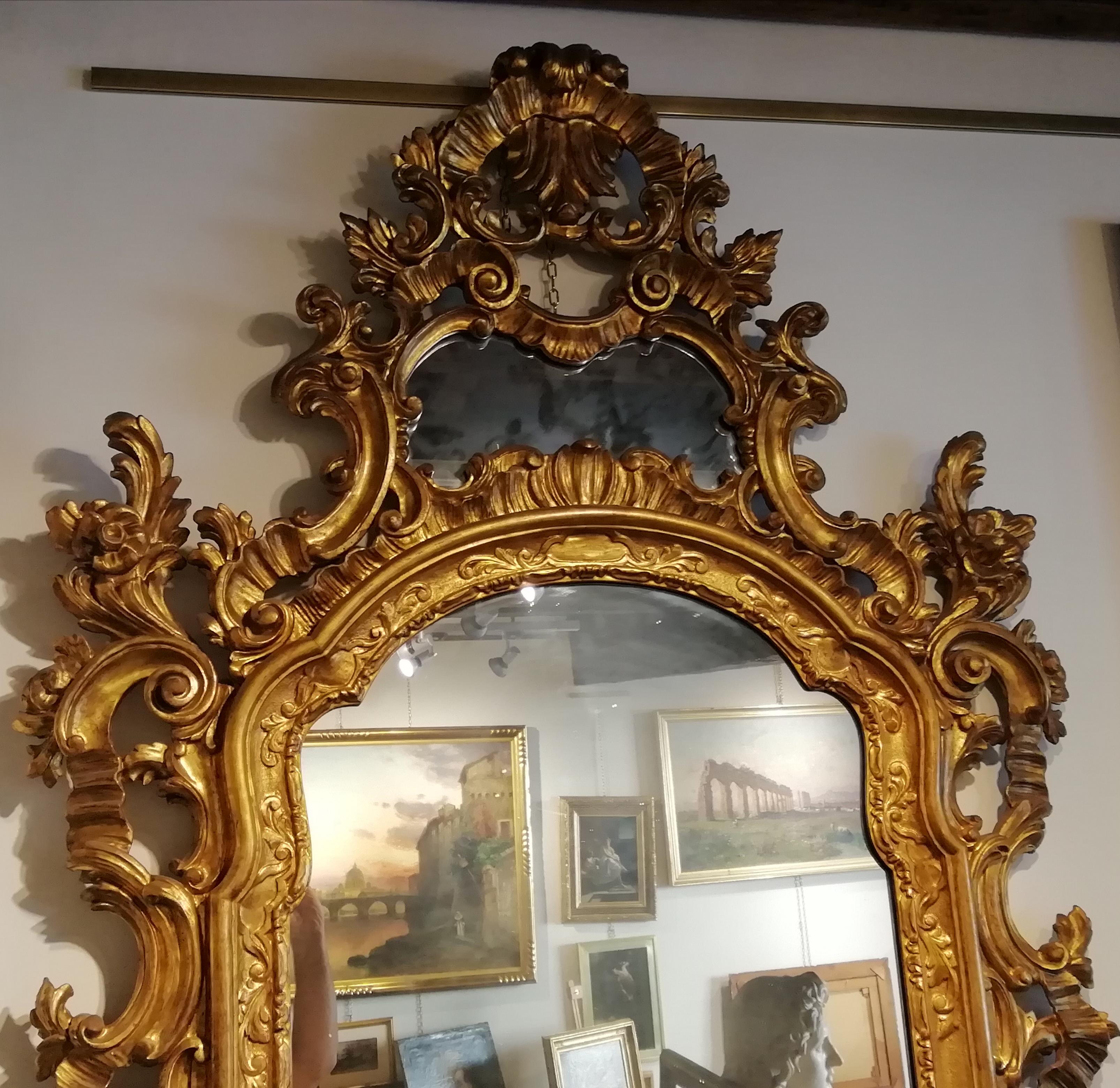 Italian manufacture 20th century
Venetian mirror


Venetian mirror model 18th century (Louis XV), built with the ancient 18th century workmanship by skilled Italian 20th century artisans.
Carved by hand and gilded with the ancient