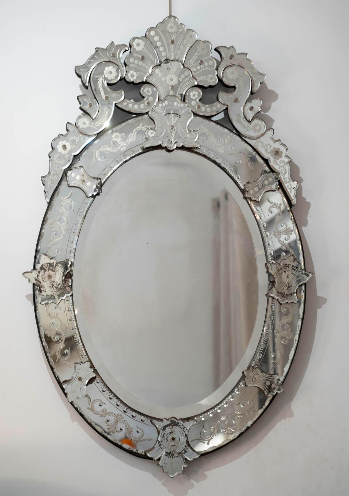 Venetian mirror from the 1920s.

Art Nouveau style Venetian mirror, 1920, engraved mirror.
H: 117cm, W: 73cm, D: 5cm